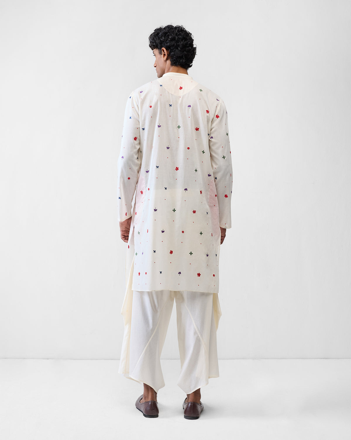 Back of an ivory Zenith Kurta with scattered embroidered flowers.