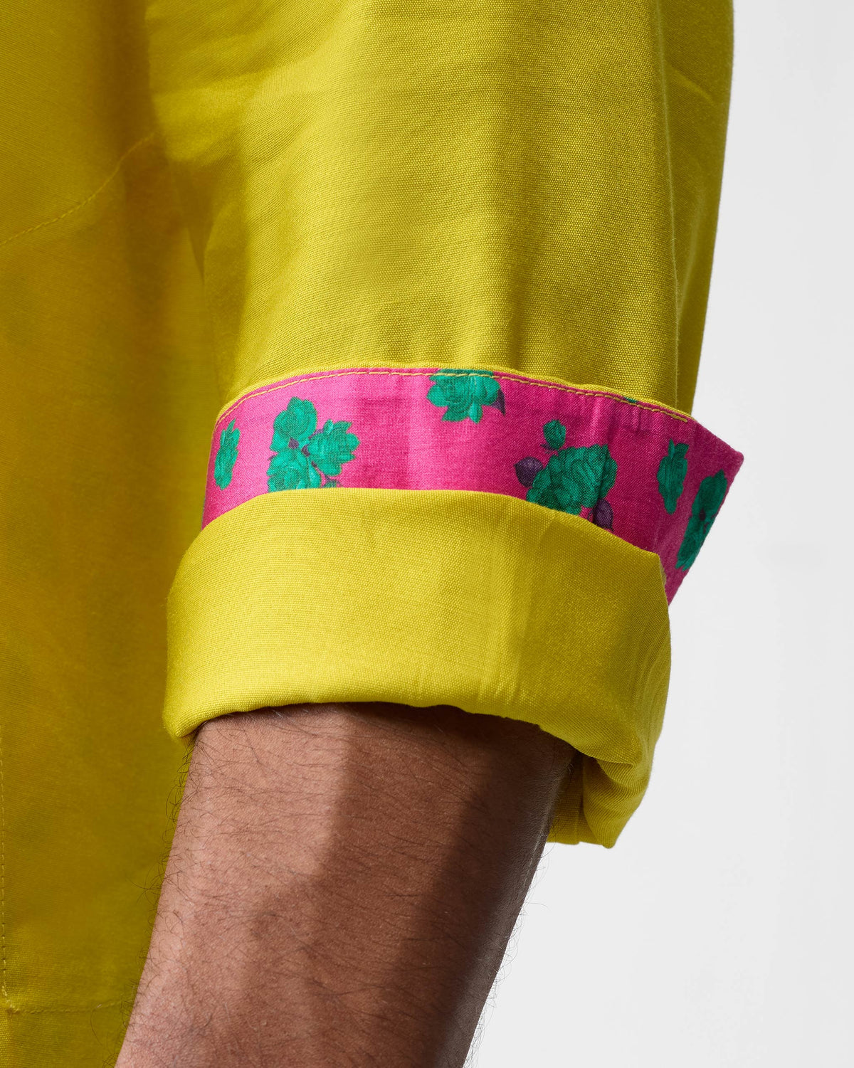 Close-up of a chartreuse Bouquet kurta sleeve with floral lining.