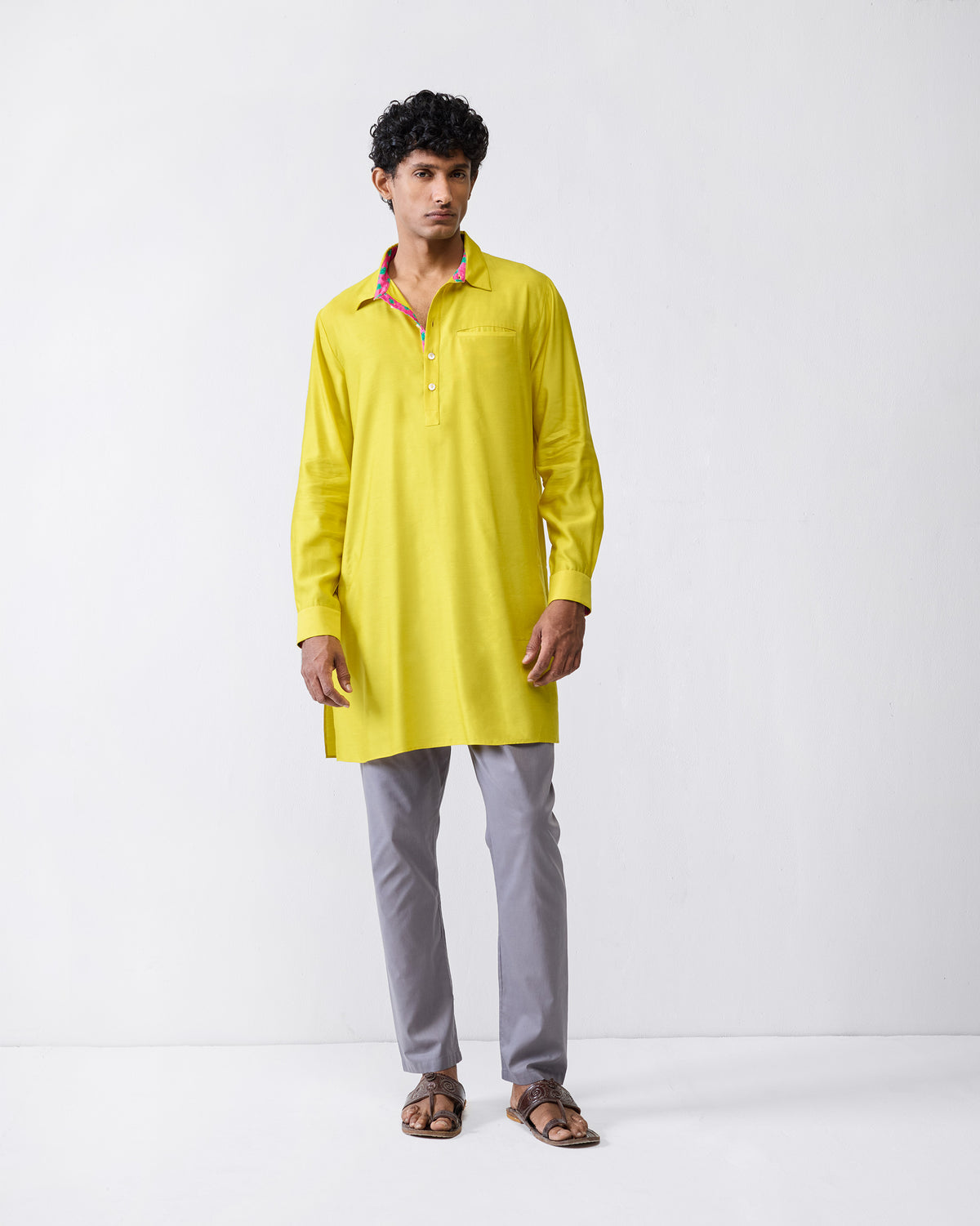 Person wearing a chartreuse Bouquet kurta with a chest pocket.