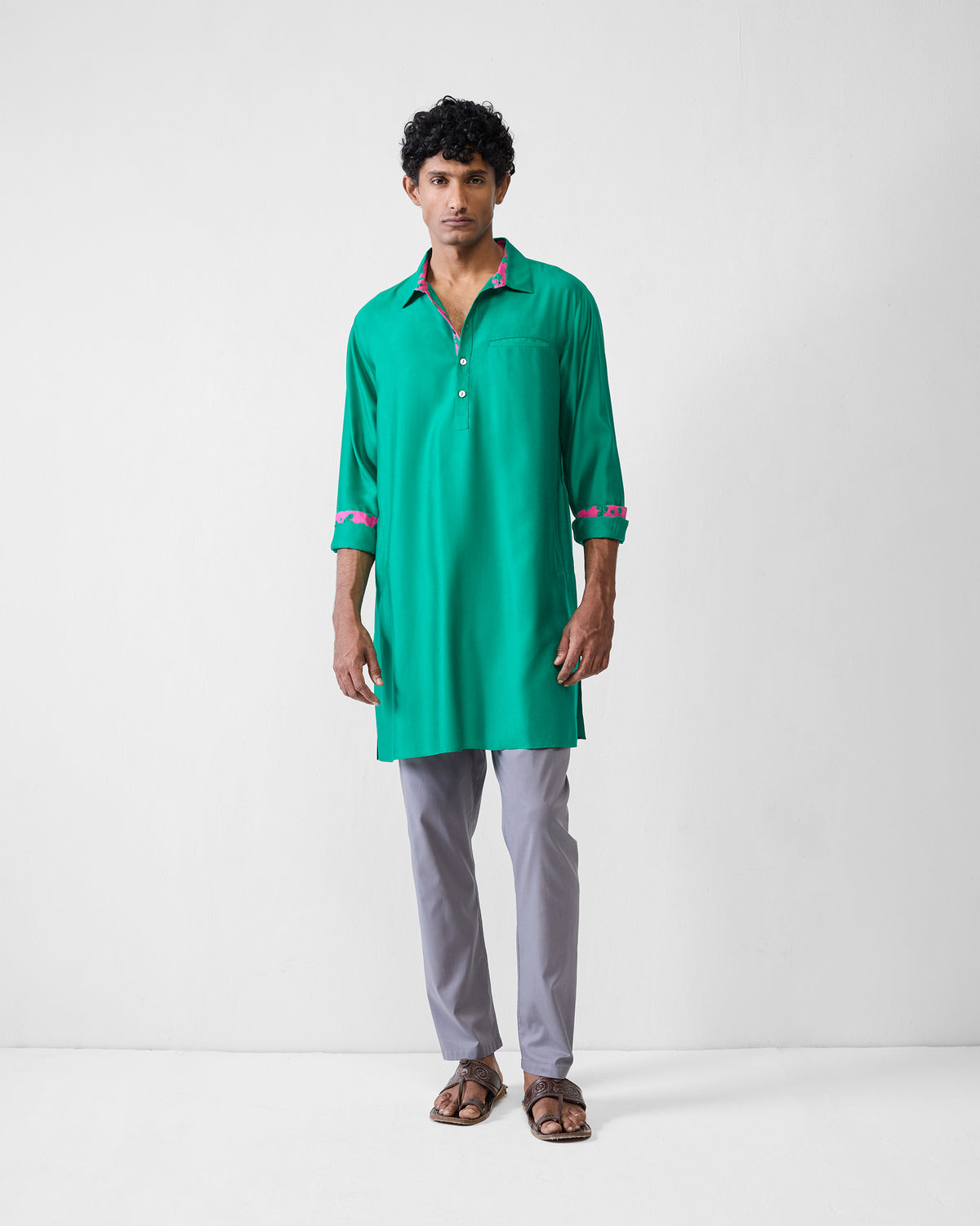 Person wearing an emerald green Bouquet kurta with a chest pocket.