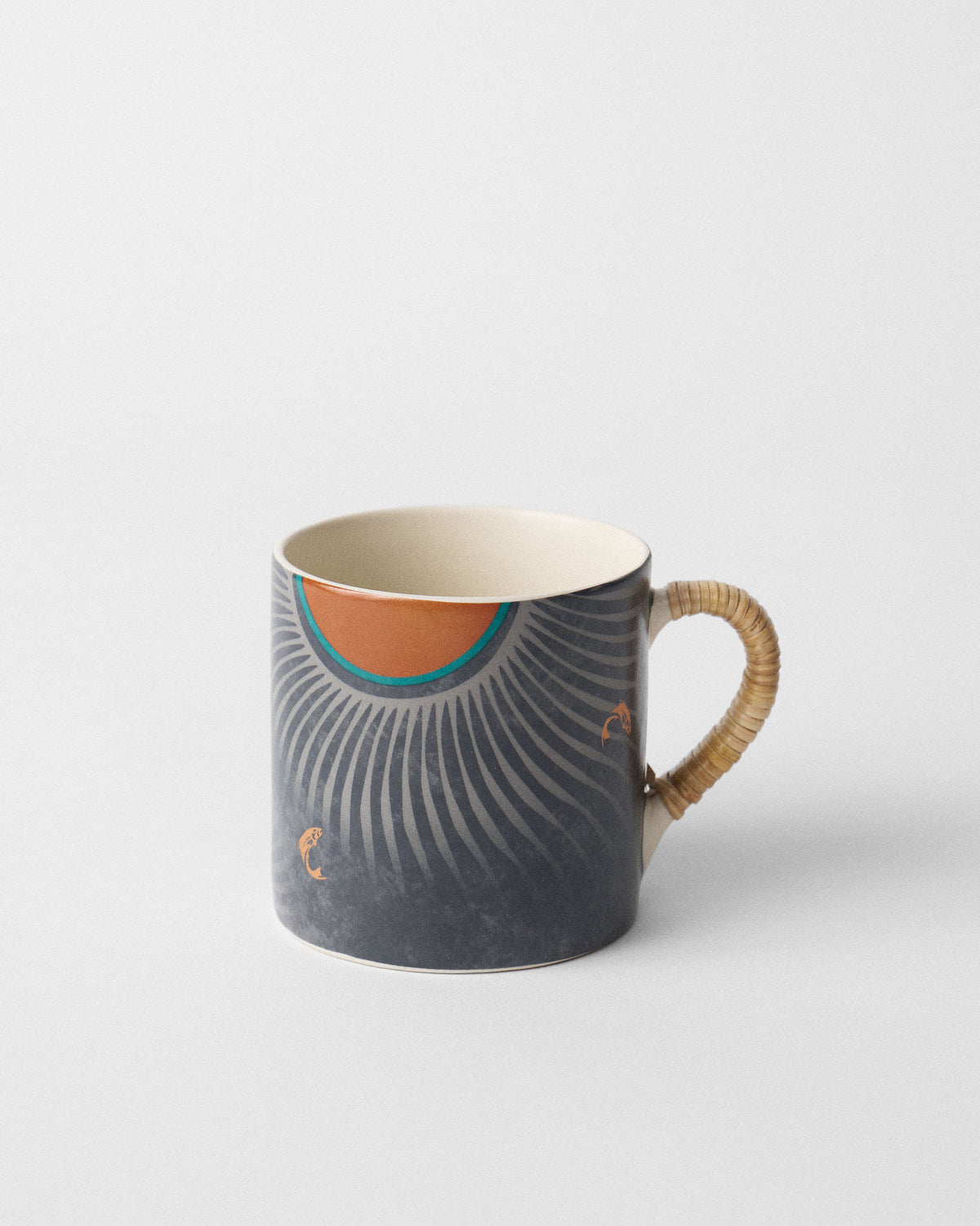 Side view of Cascade Straight Mug with grey fan rays, an orange sun and rattan handle.