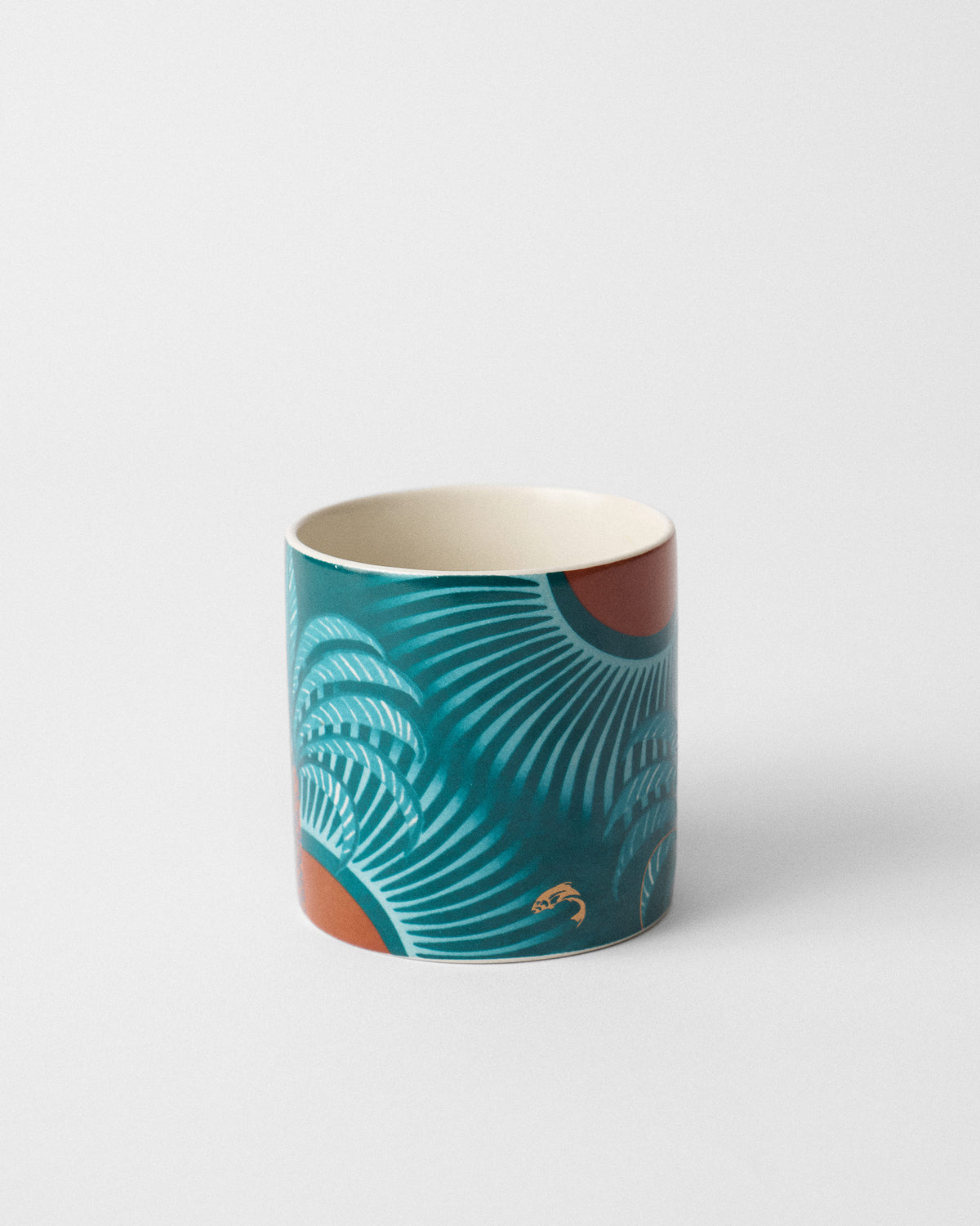 Caden Straight Mug from the opposite side with teal fan rays and an orange sun.