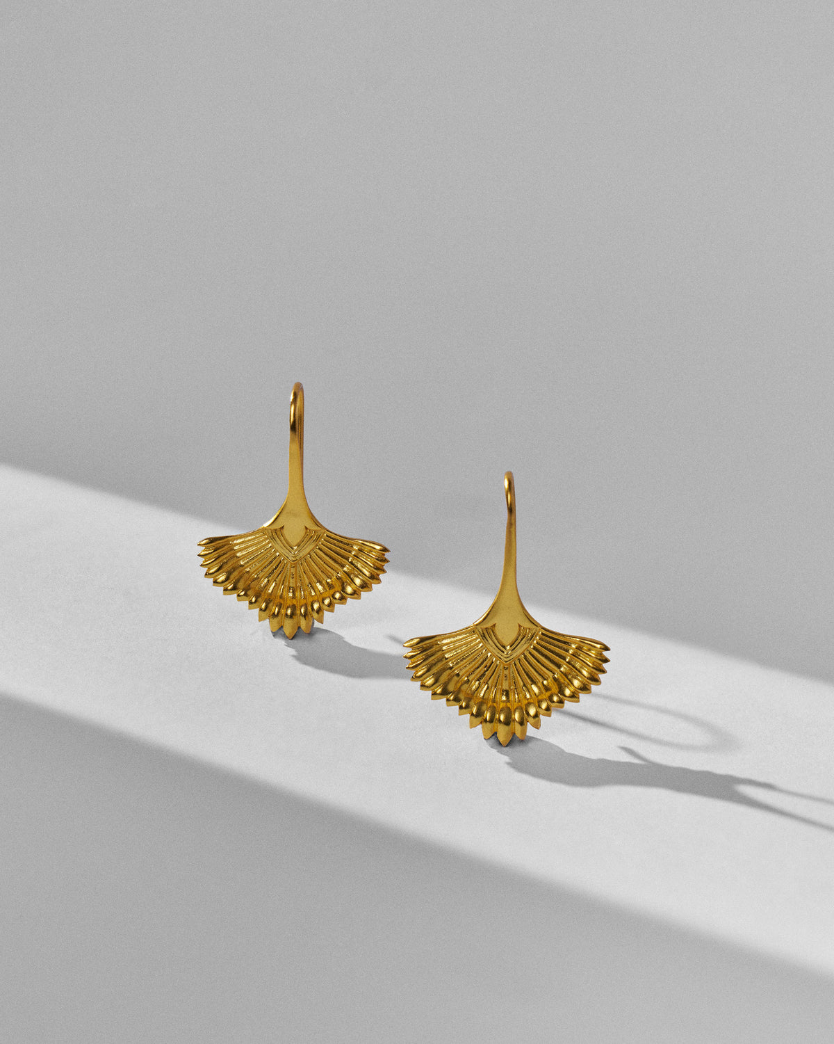Gold Festive Palm danglers standing to show radiating ridges and scalloped edges.