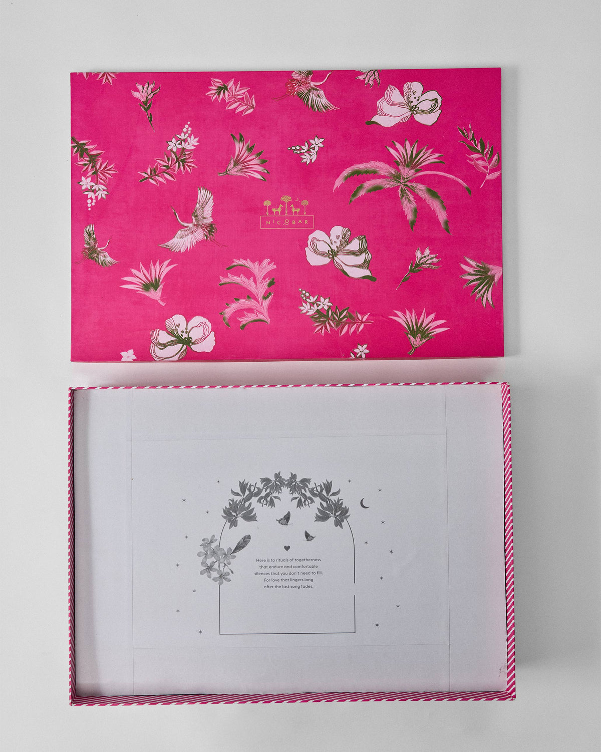 Open pink gift box for the Ceylon Trail Dinner Gift Set, showing a printed insert card.