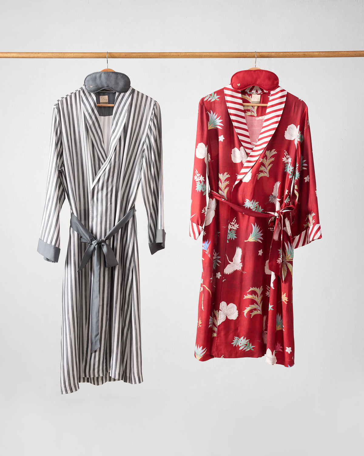 Reverie gift set with striped and red crane-print robes and sleep masks.