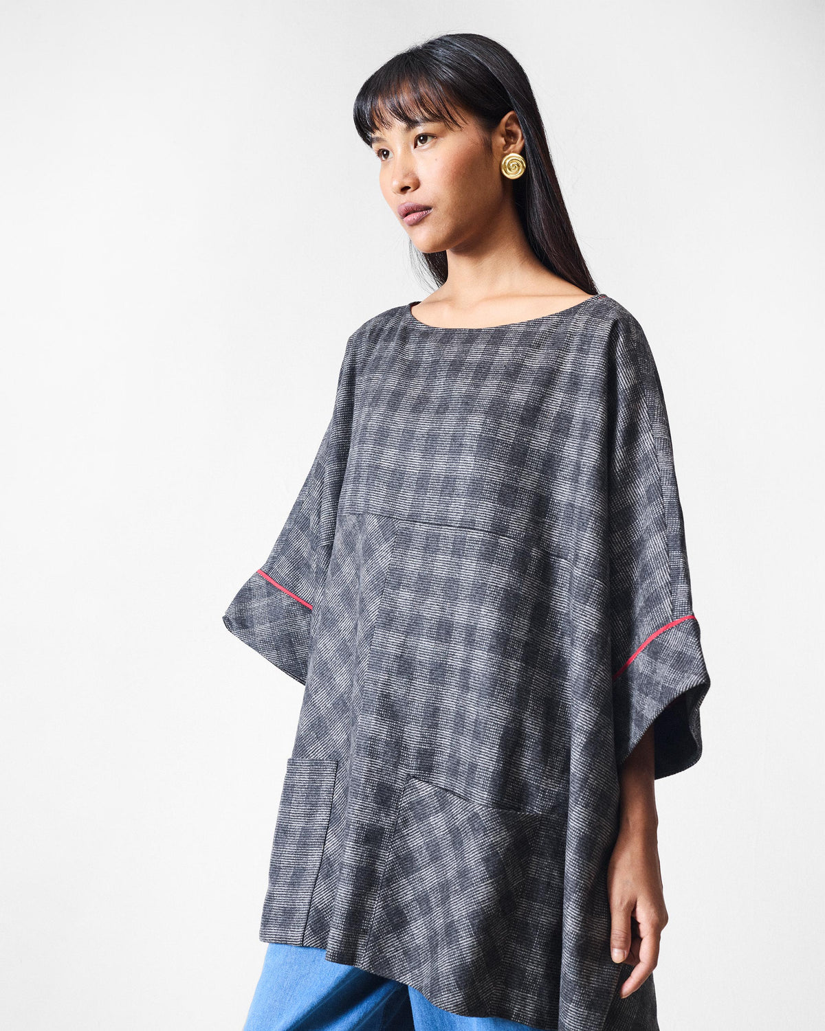 Fable Top in black and charcoal check with wide sleeves and patch pockets.