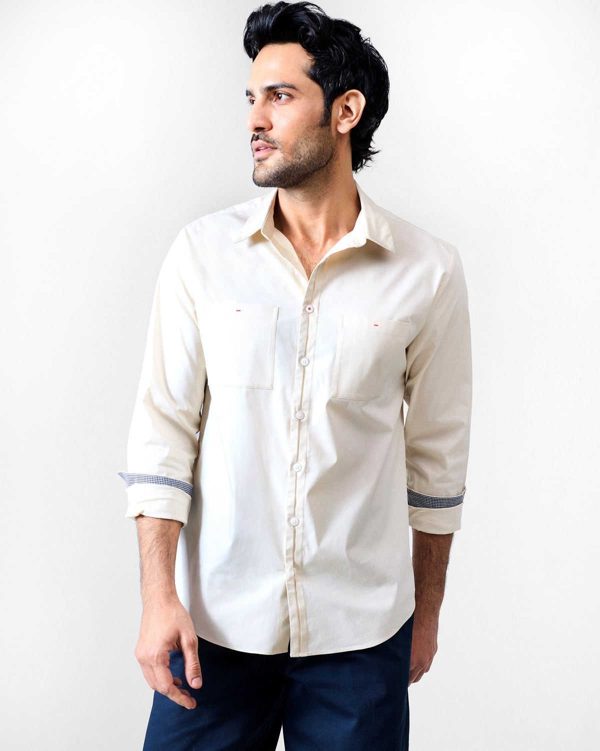 Ivory Abe shirt with twin chest pockets and red bar-tack details.