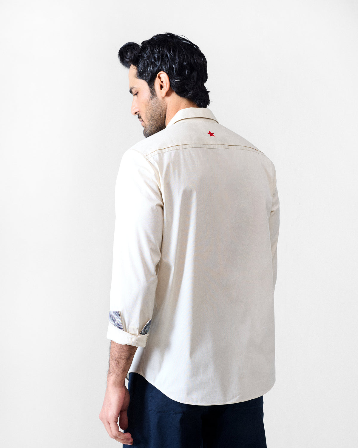 Ivory Abe shirt with a red star embroidered at the centre-back yoke.