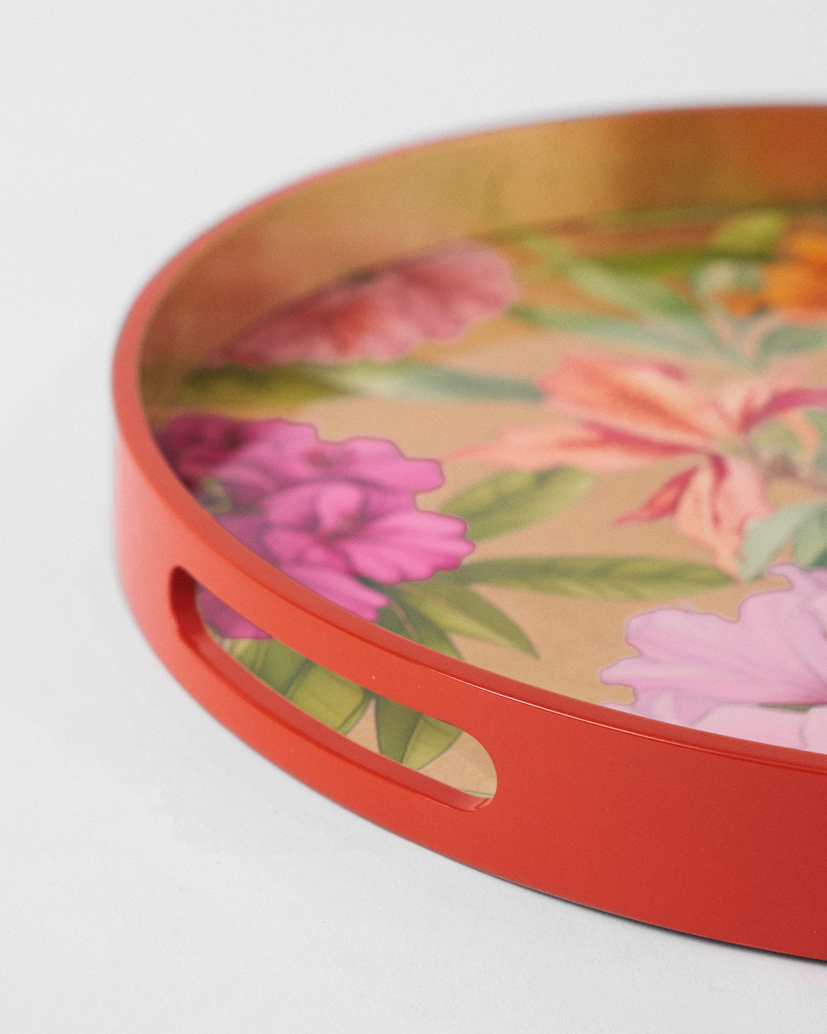 Close-up of the Blooming Flower tray cutout handle and red rim.