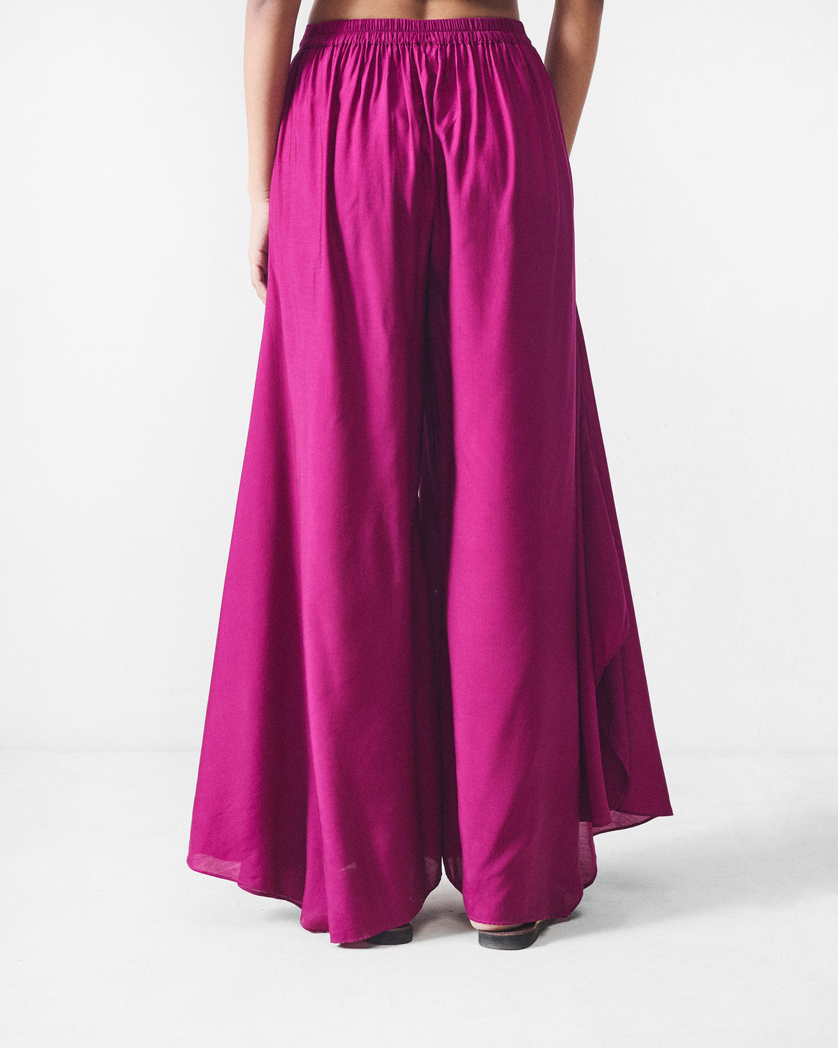 Back of mulberry Uneven Hem pants with a gathered waistband.