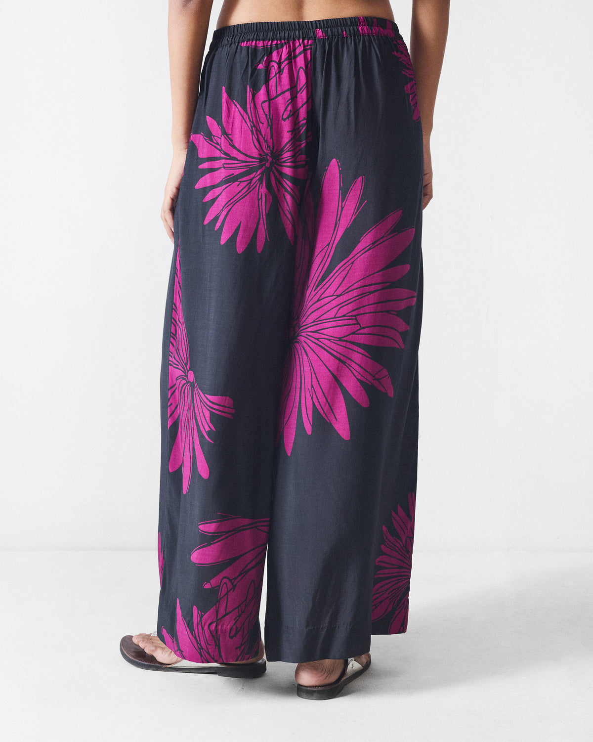 Back of black and mulberry printed Basic pyjamas with an elastic waist.