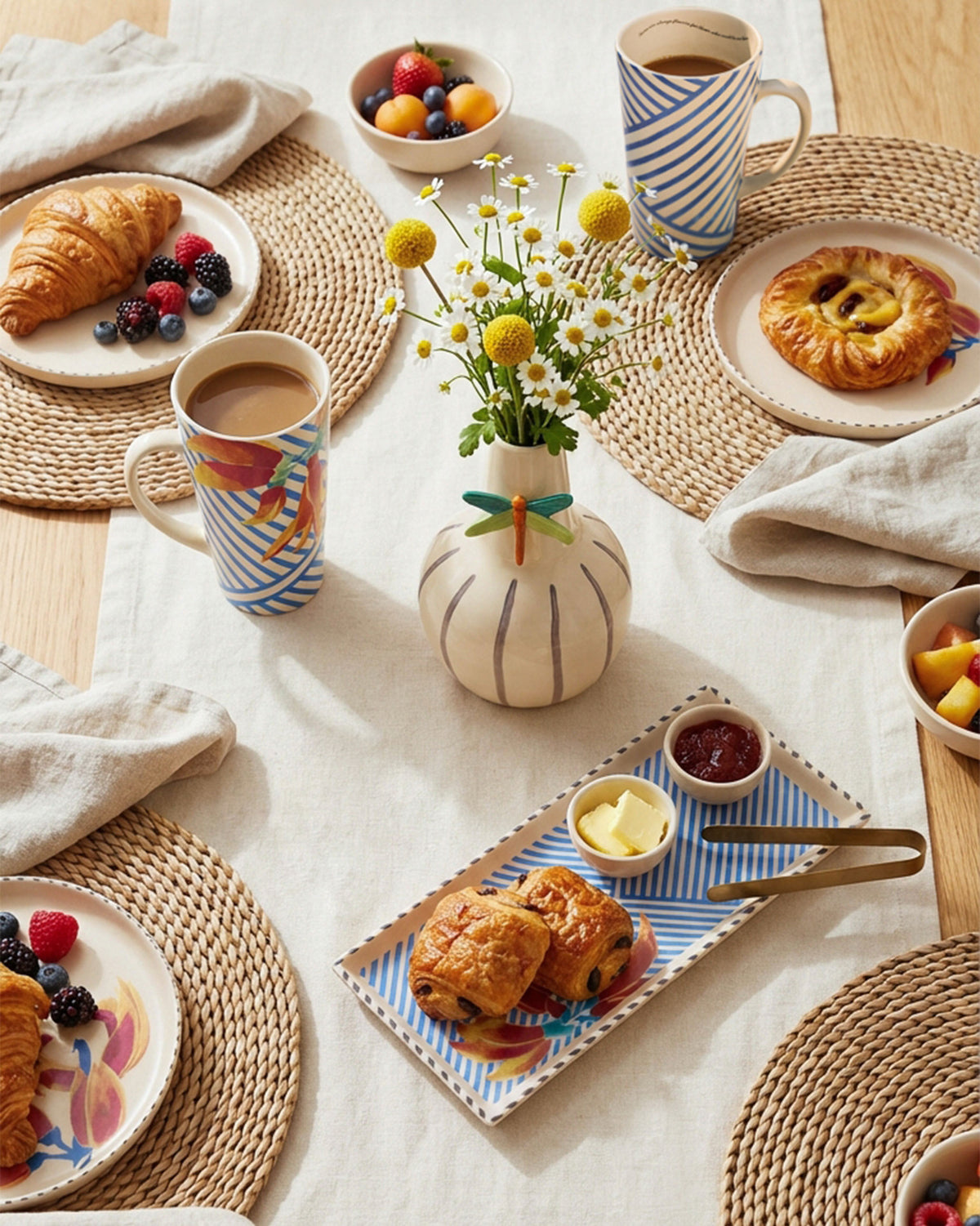 Palash cookie tray with tongs holding pastries on a breakfast table.