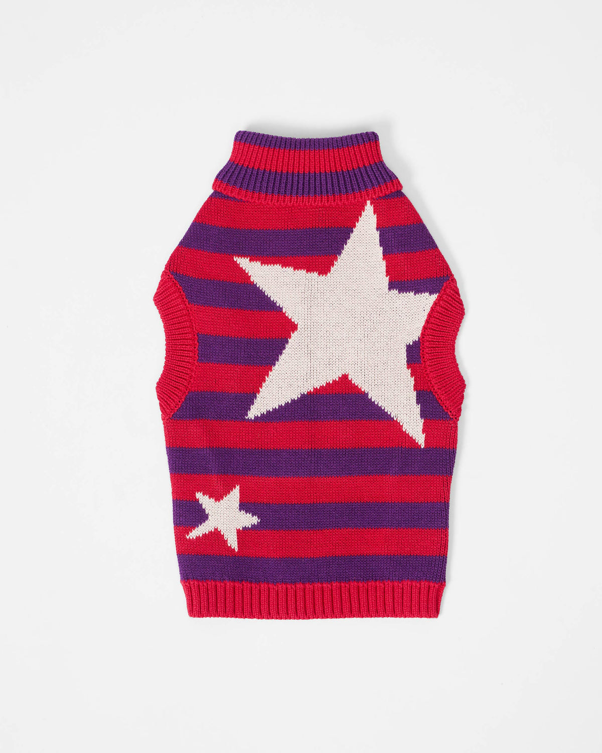 Red and purple striped Cosmic Canine dog sweater with white stars laid flat.