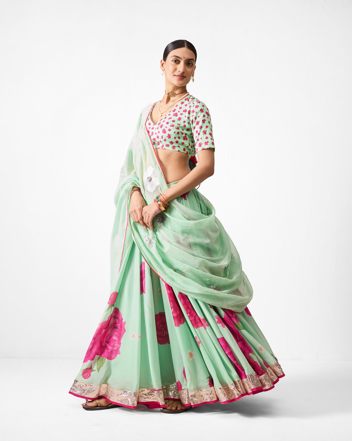 Sea blue embroidered Fiza Dupatta with pink border draped over the shoulder.