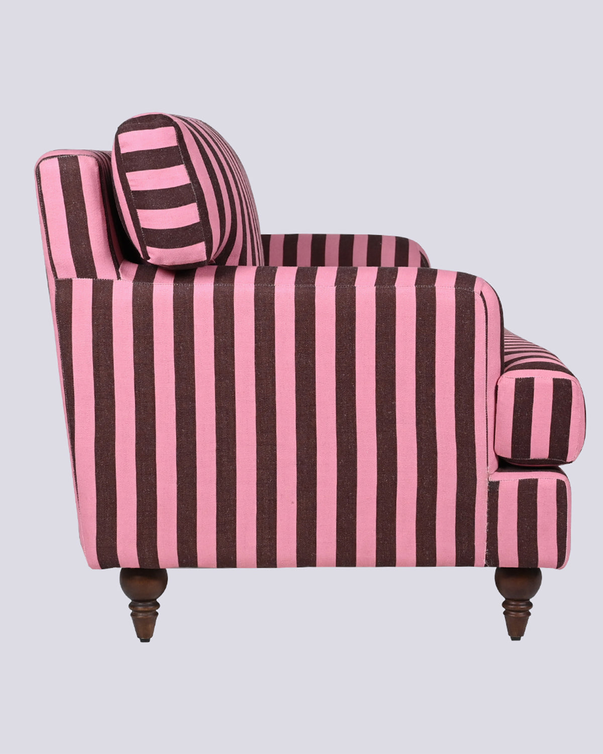 Side profile of the Reef Sofa in pink and brown stripes.