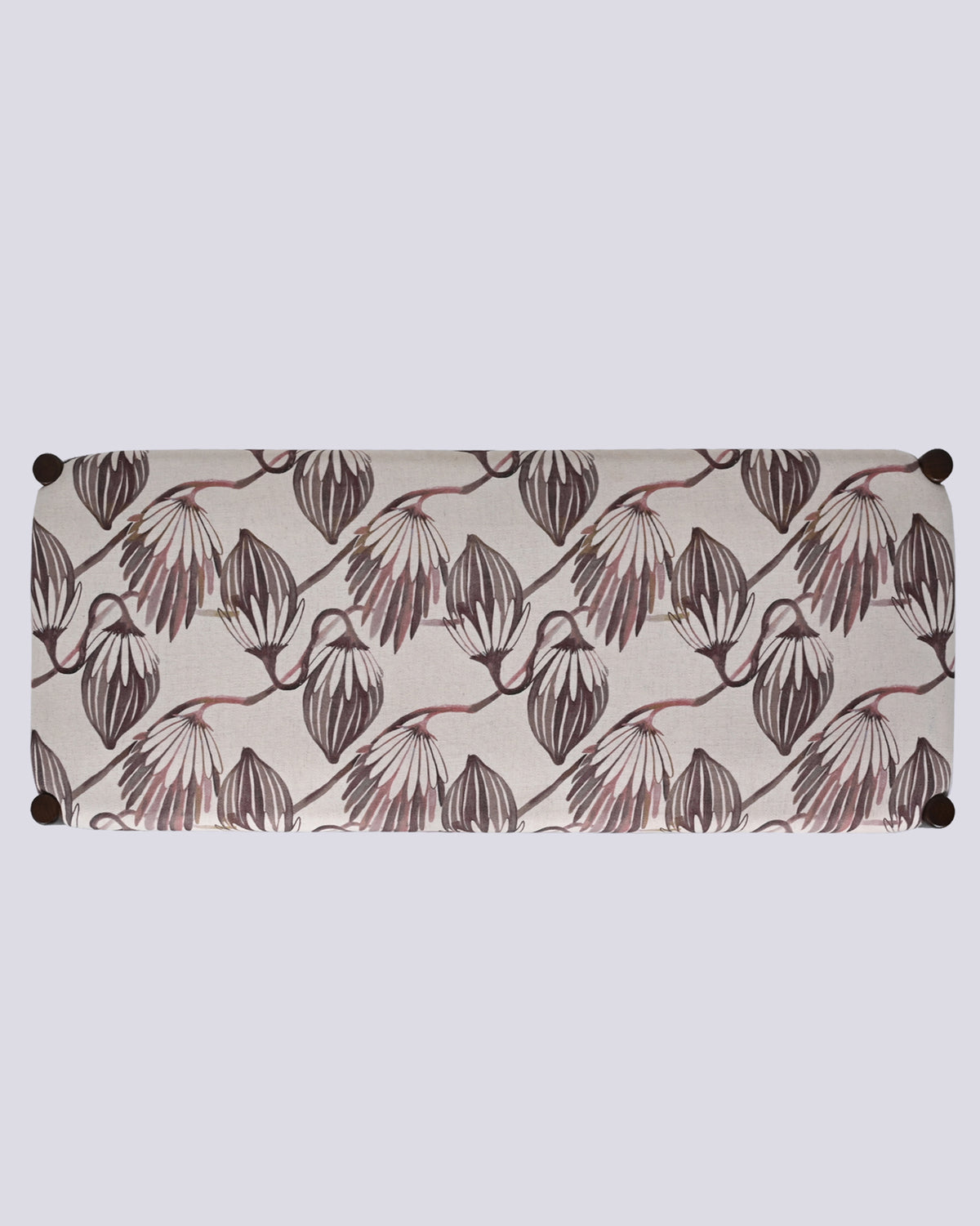 Overhead view of the Moor Bench seat with mauve botanical motifs on cream fabric.