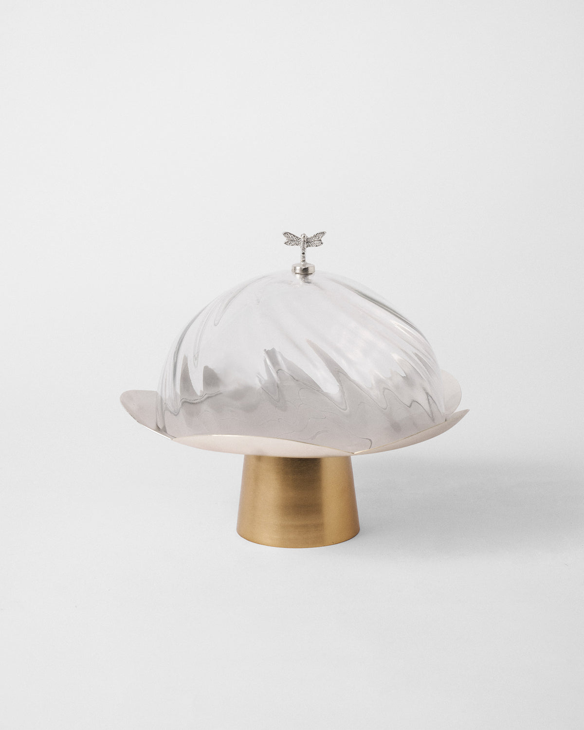 Clear glass Almond Blossom Cloche with a silver dragonfly knob on a brass petal base.