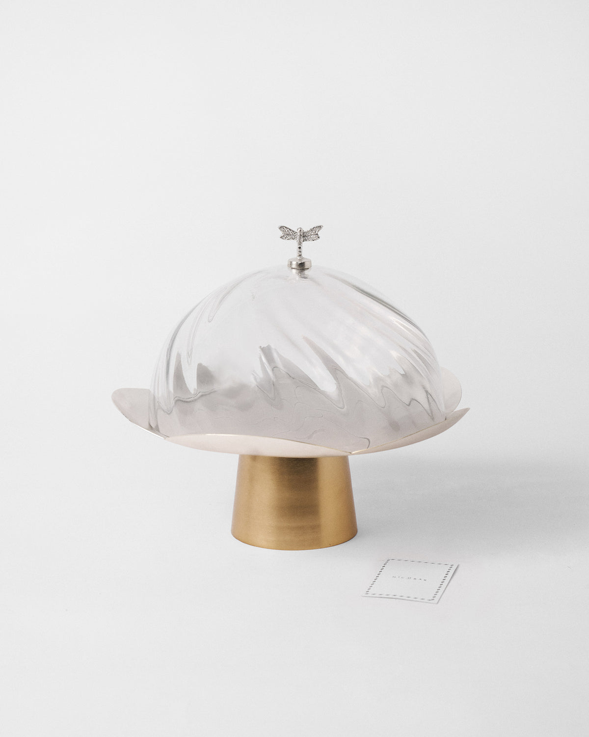 Almond Blossom Cloche with a dragonfly knob on a gold petal pedestal base.