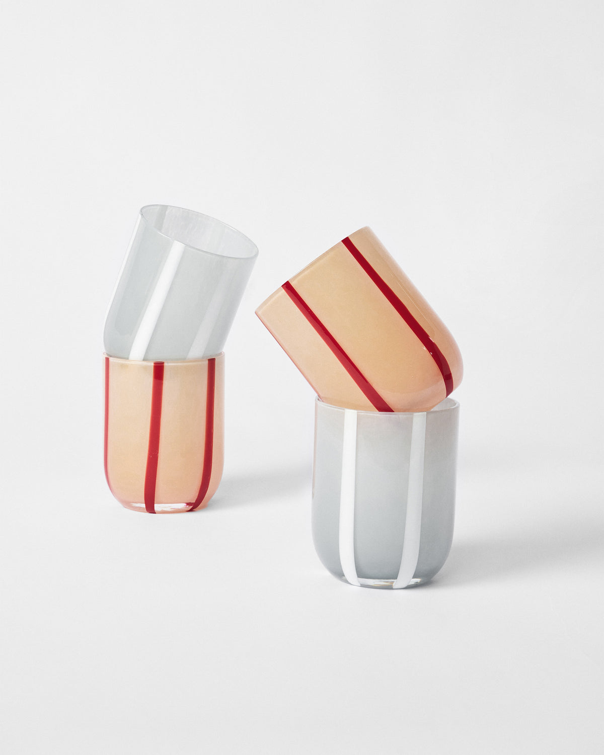 Demi striped glasses stacked in tilted pairs.