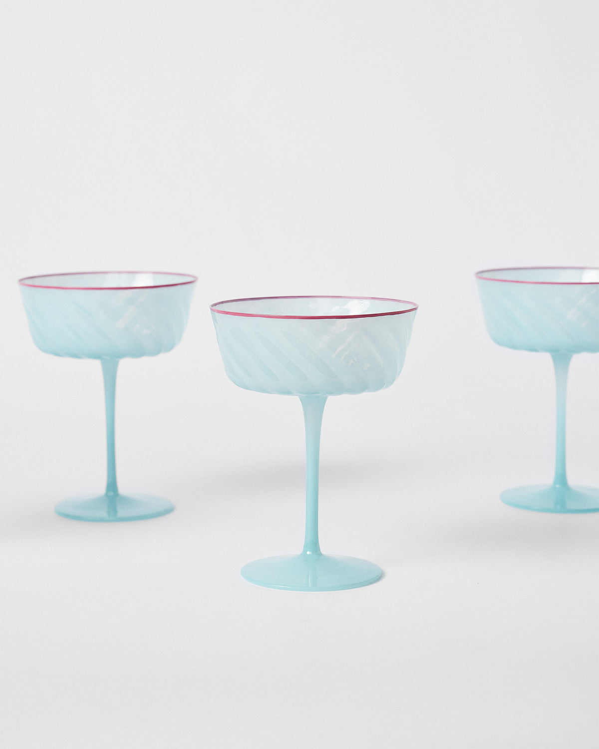 Ripple Margarita Glasses with swirled bowls, shown at an angle on a white background.