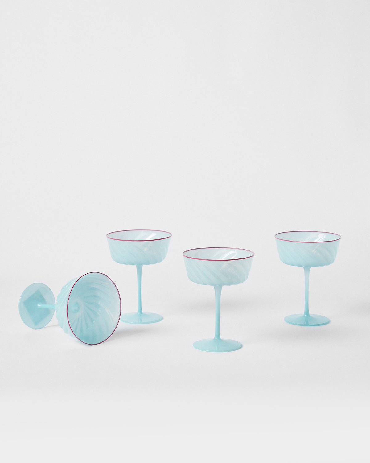 Ripple Margarita Glasses arranged on a white background, one tipped on its side.