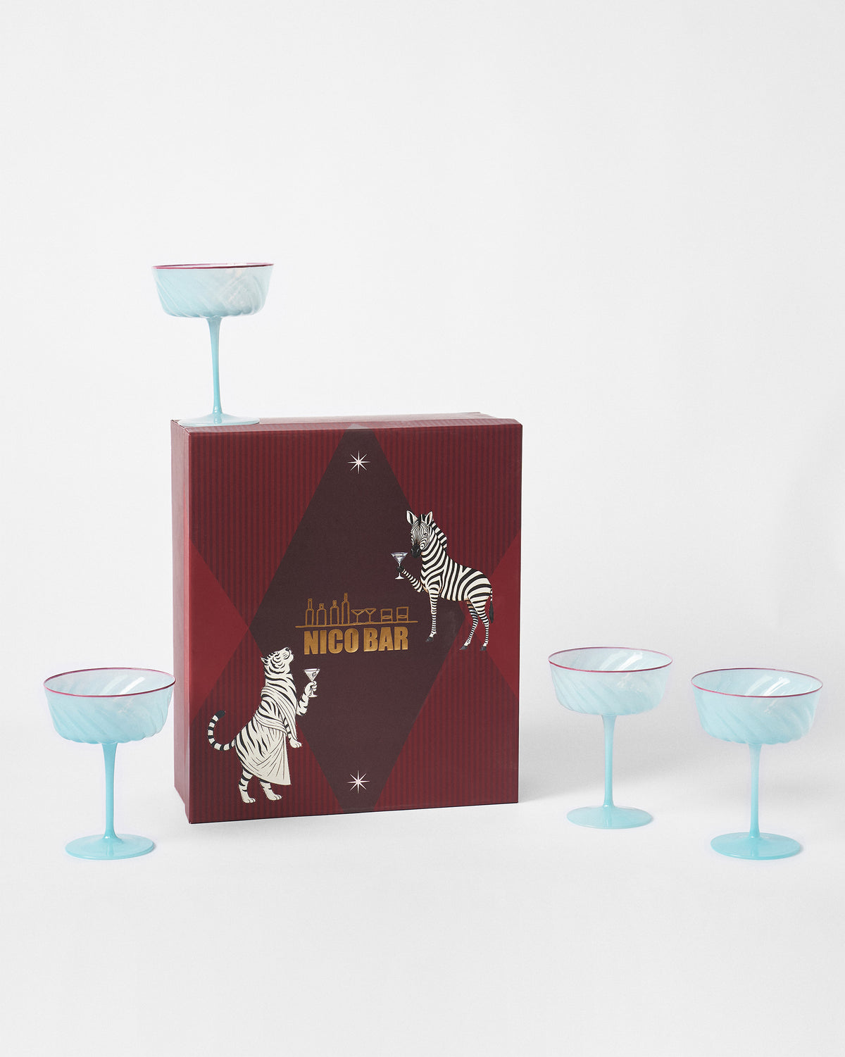 Ripple Margarita Glasses arranged around a red gift box with zebra and tiger artwork.