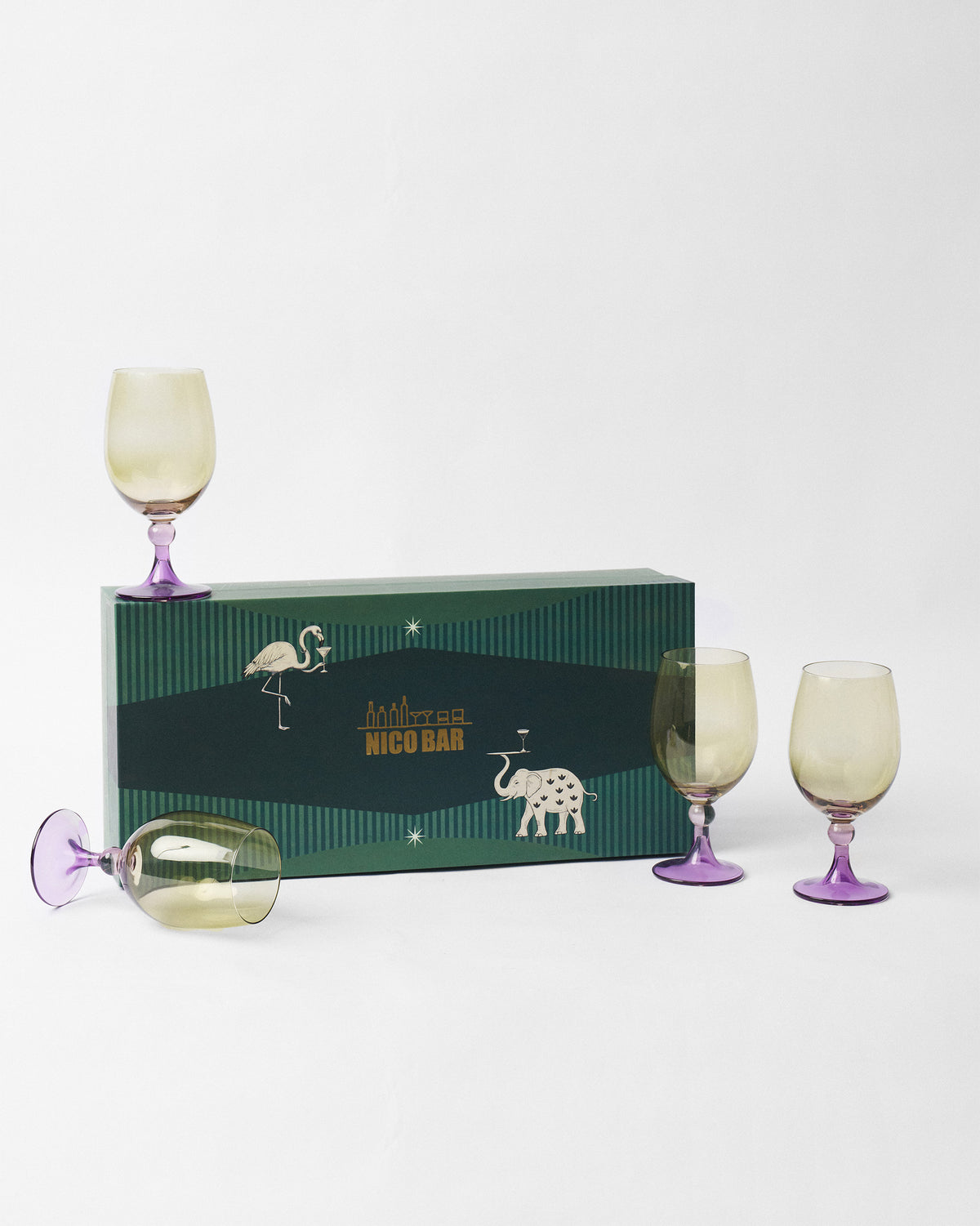 Cairo gin goblet set of four beside a green illustrated Nicobar gift box.