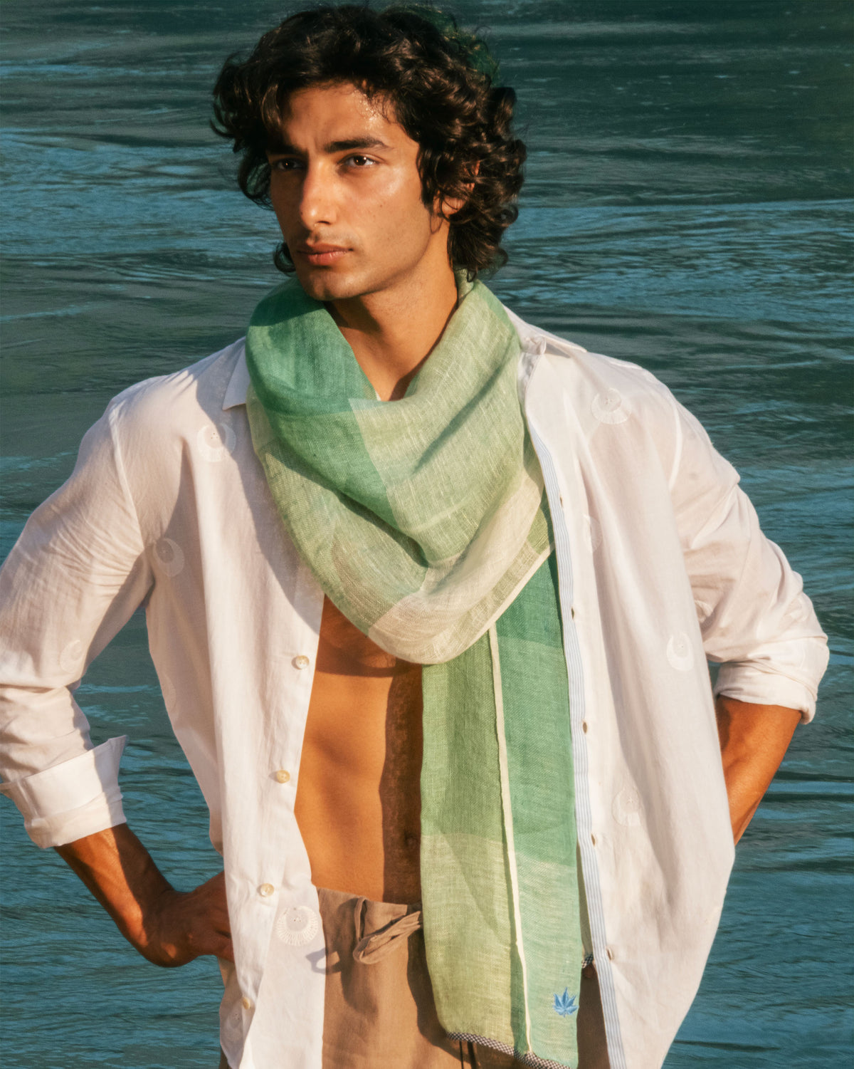 Person wearing a Summer Field Scarf in green and white check.