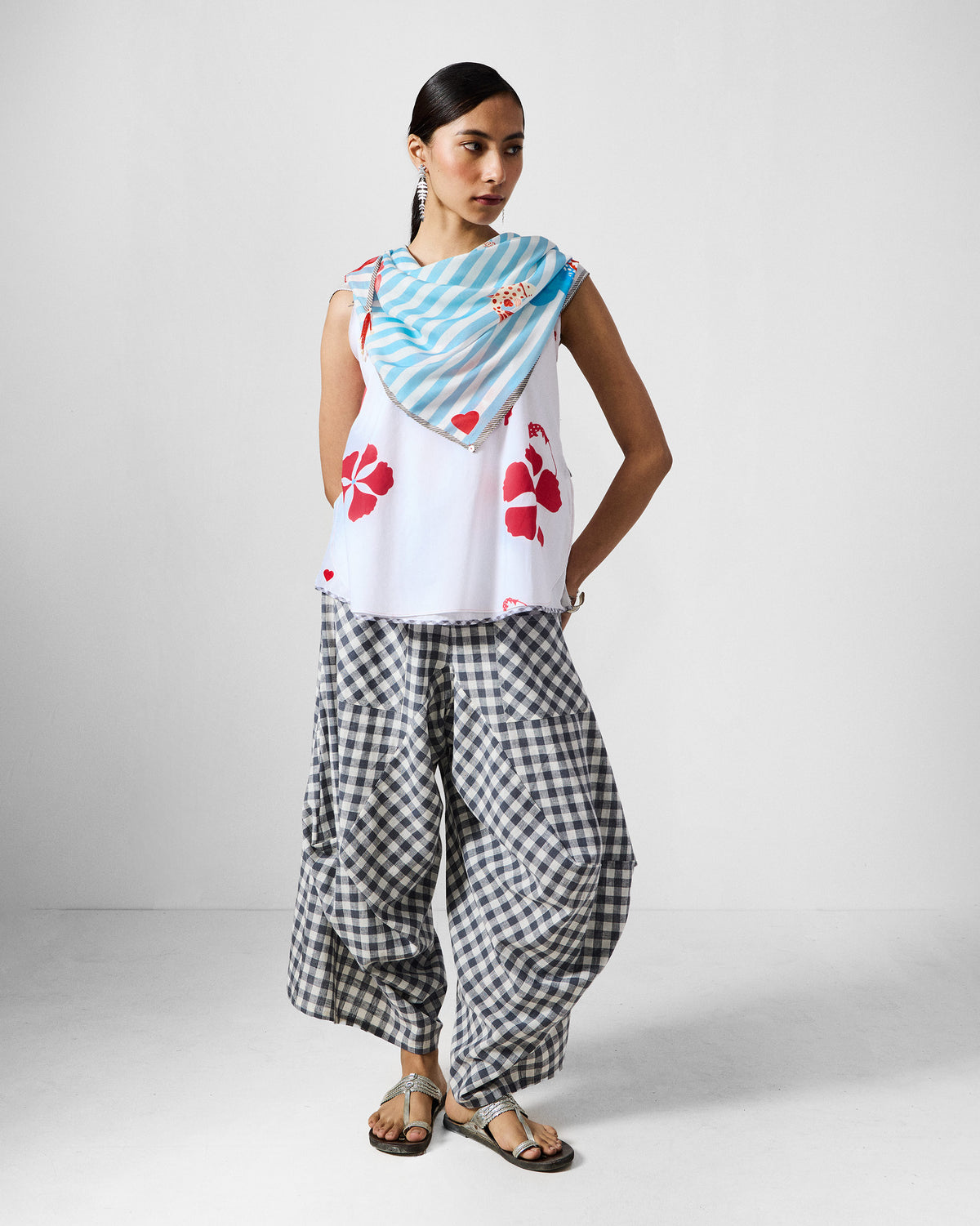 Person wearing the Fields Scarf in ice blue stripes draped at the neck.