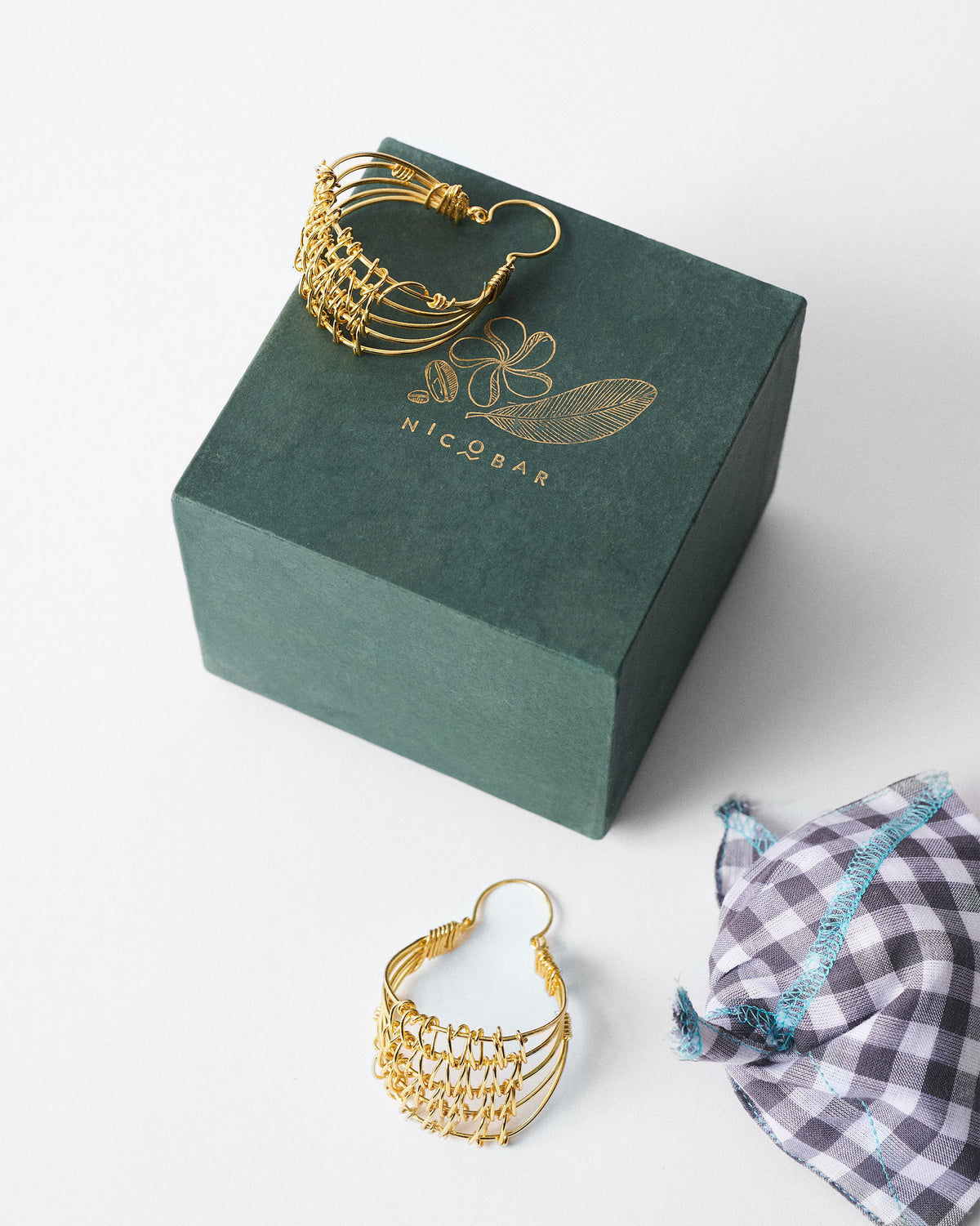 Gold Shore wire balis with a green Nicobar gift box.