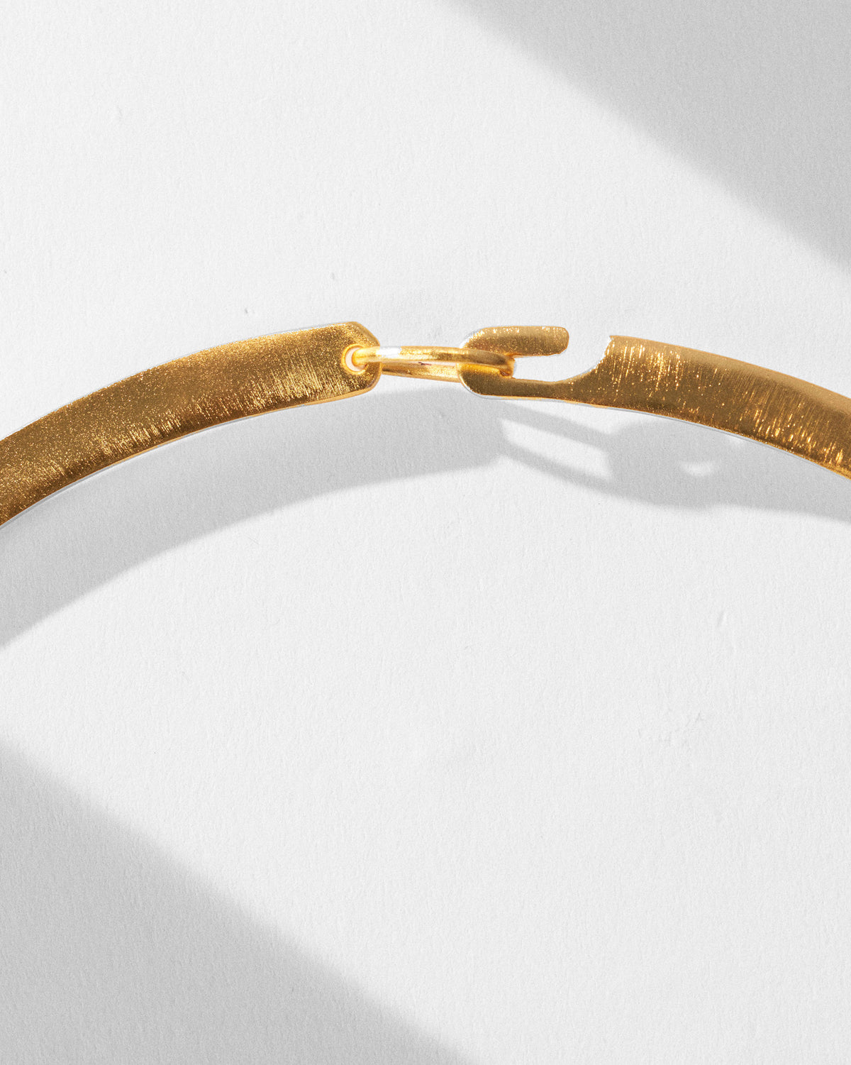 Close-up of the hook clasp on a gold sindhu choker.