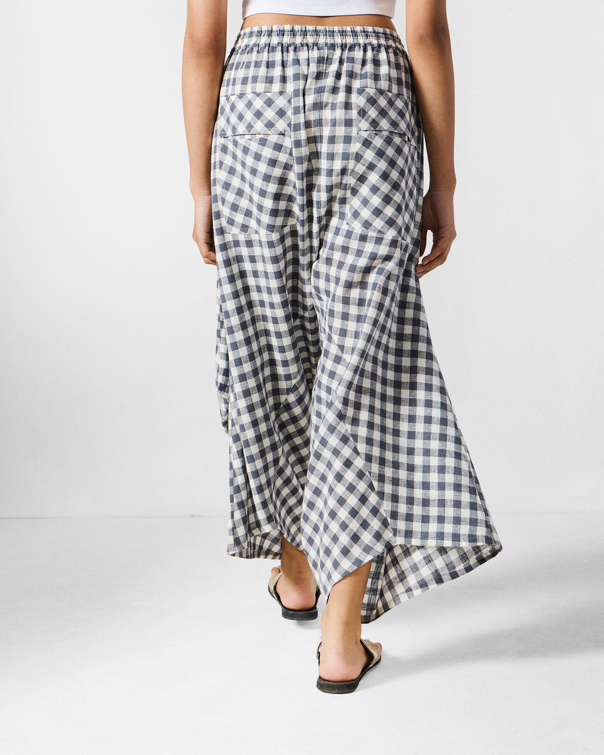 Back of grey and white checked Yoka trousers with patch pockets.