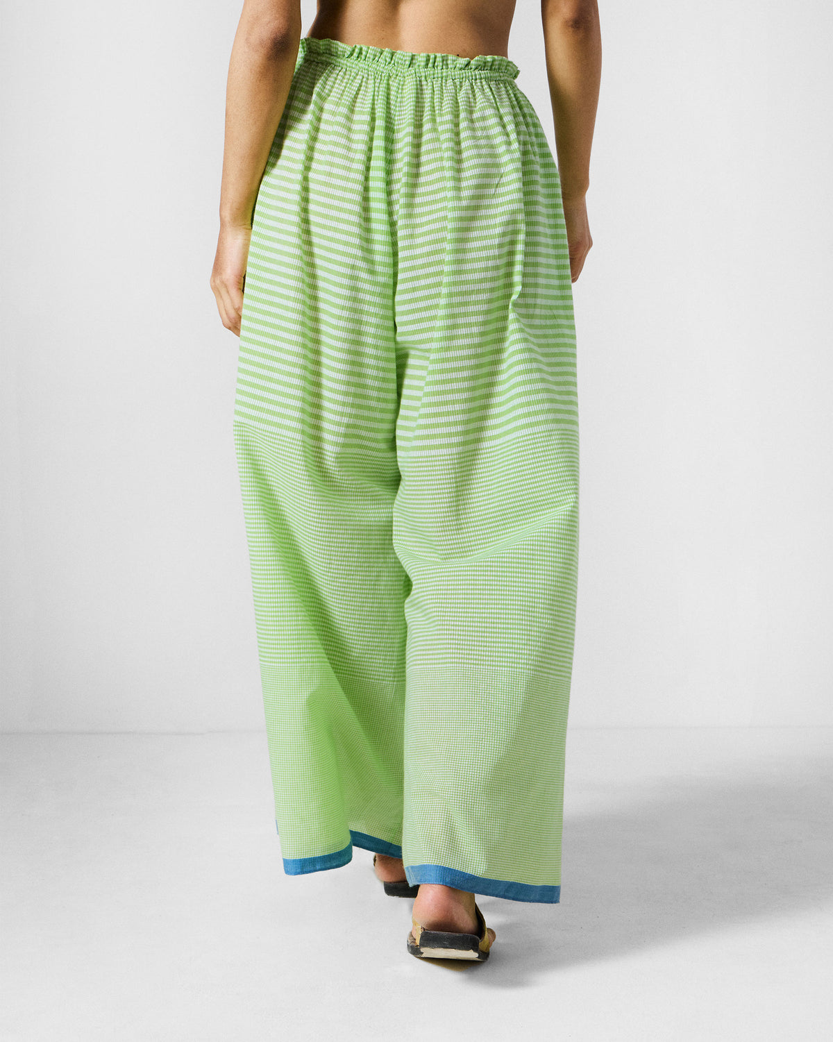 Back of light green and white check Paperbag Pants with a gathered waist.