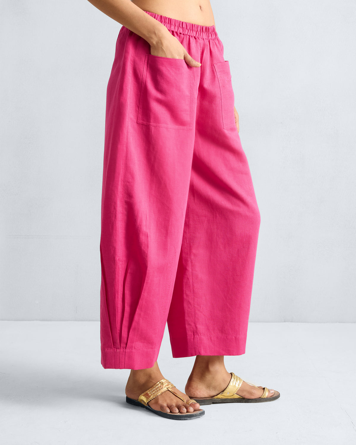 Side view of fuchsia Serene pants with a wide cropped leg.