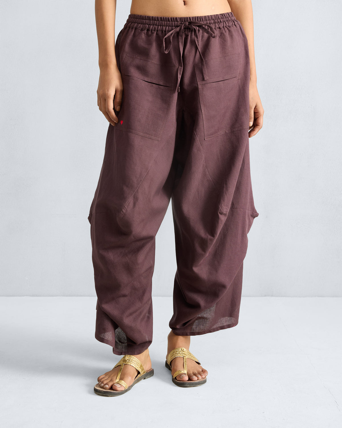 Chocolate plum Yoka Trousers with a flared silhouette.