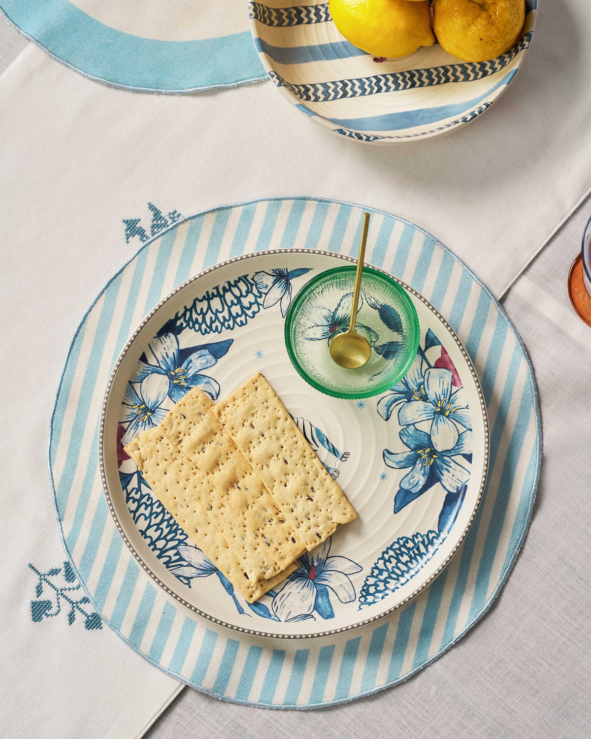 River Tiger platter serving crackers with a green glass dip bowl.