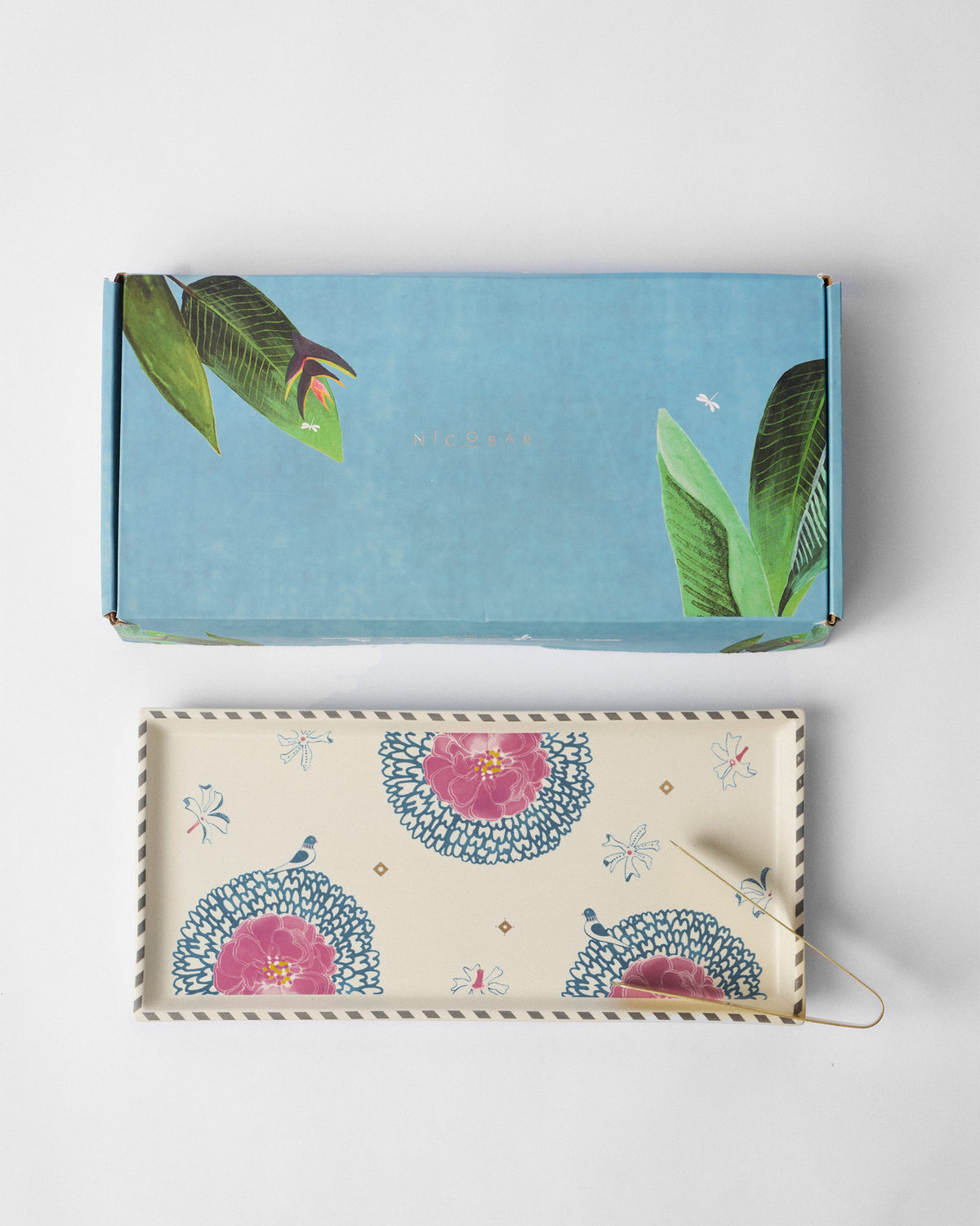 Marigold Cookie Tray With Tong beside its blue printed box.