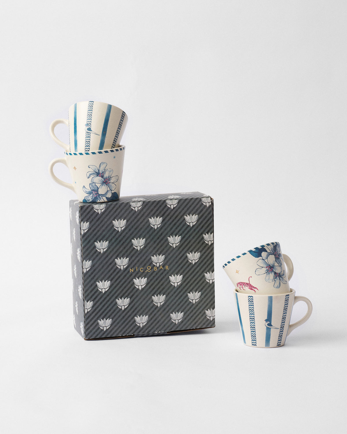 River Tiger espresso mug set of four with a Nicobar striped gift box.