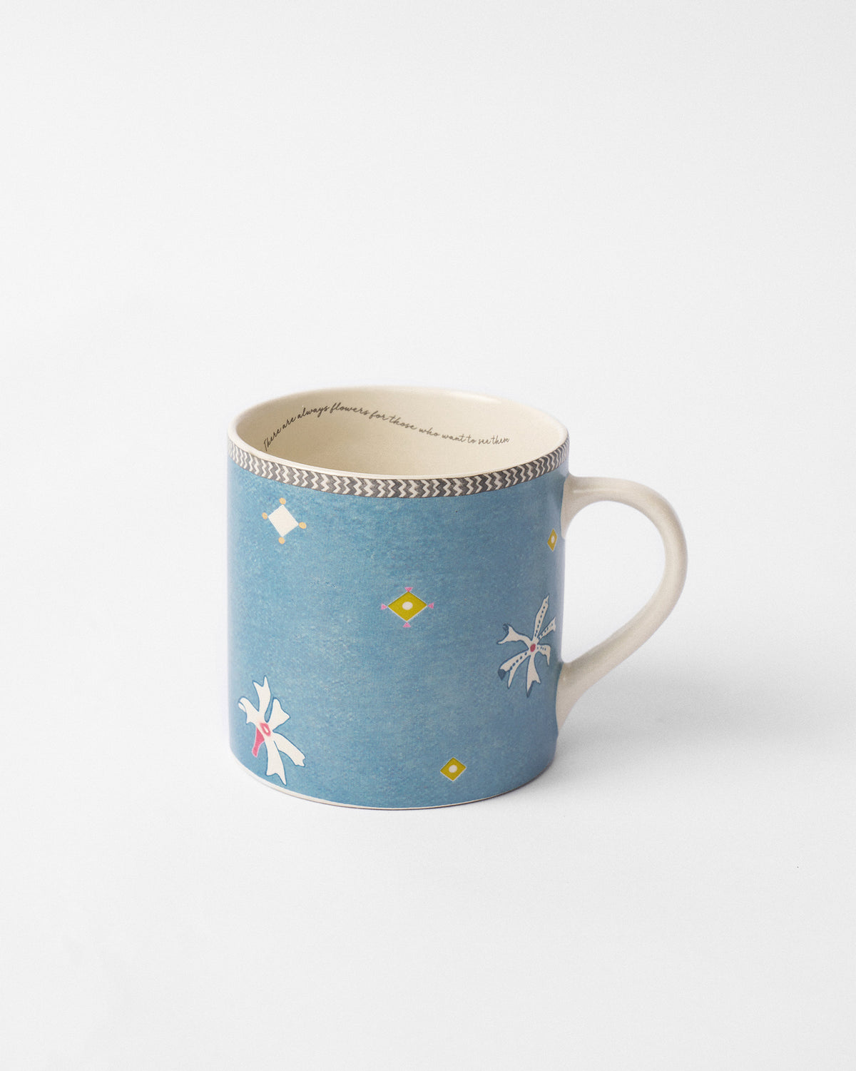 Parijat straight mug in blue with white motifs and yellow diamond accents.