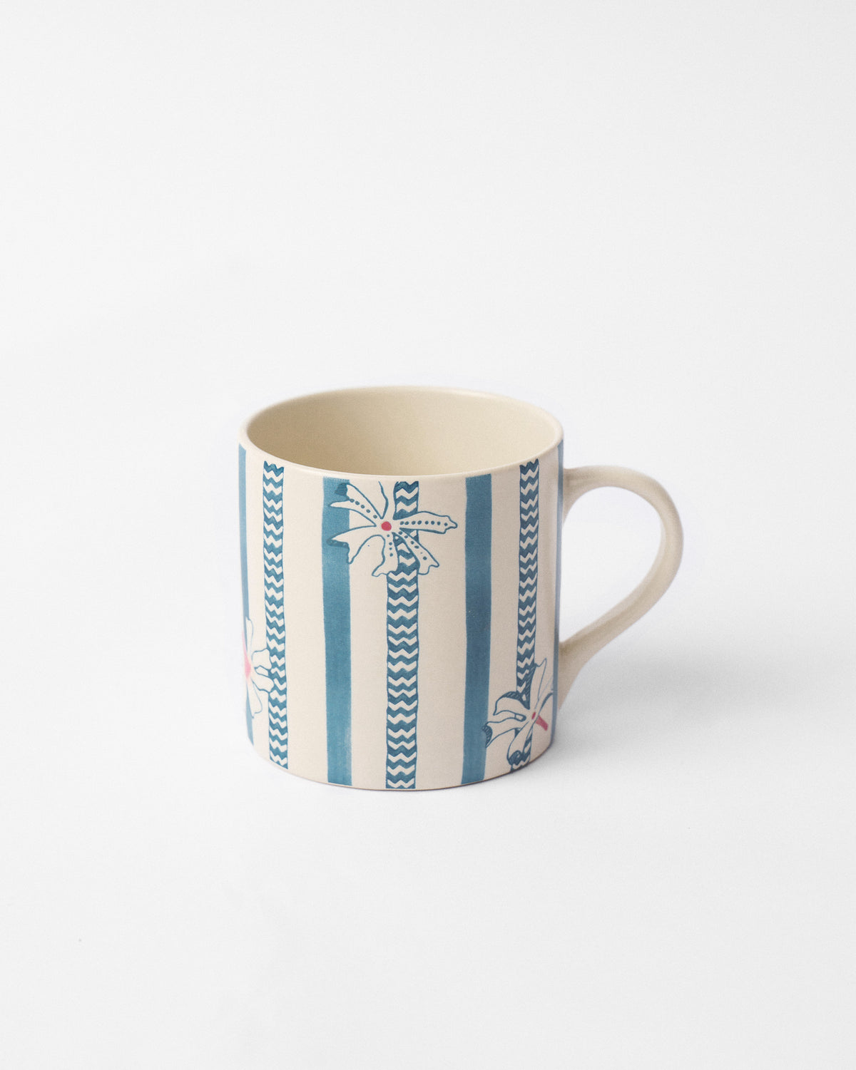 Side view of the River Tiger straight mug with blue stripes and white flowers.