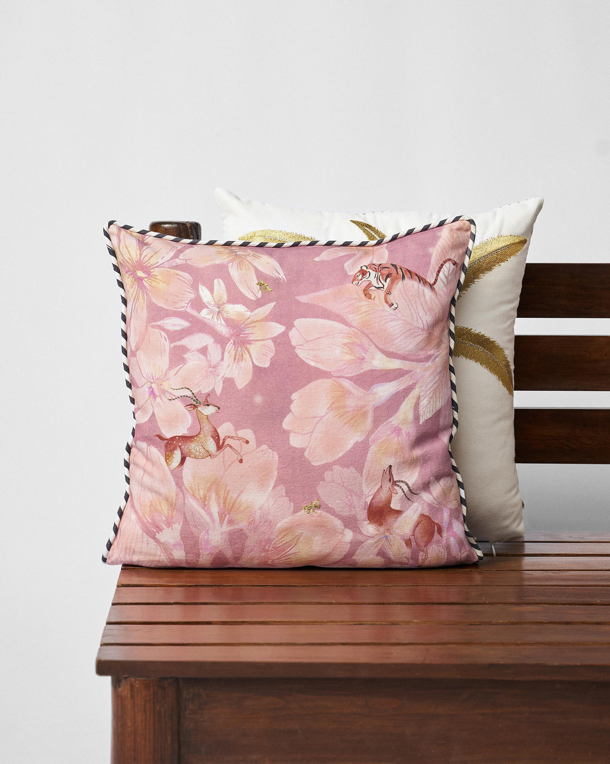 Stag Cushion Cover in a pink floral print with a striped piped edge.