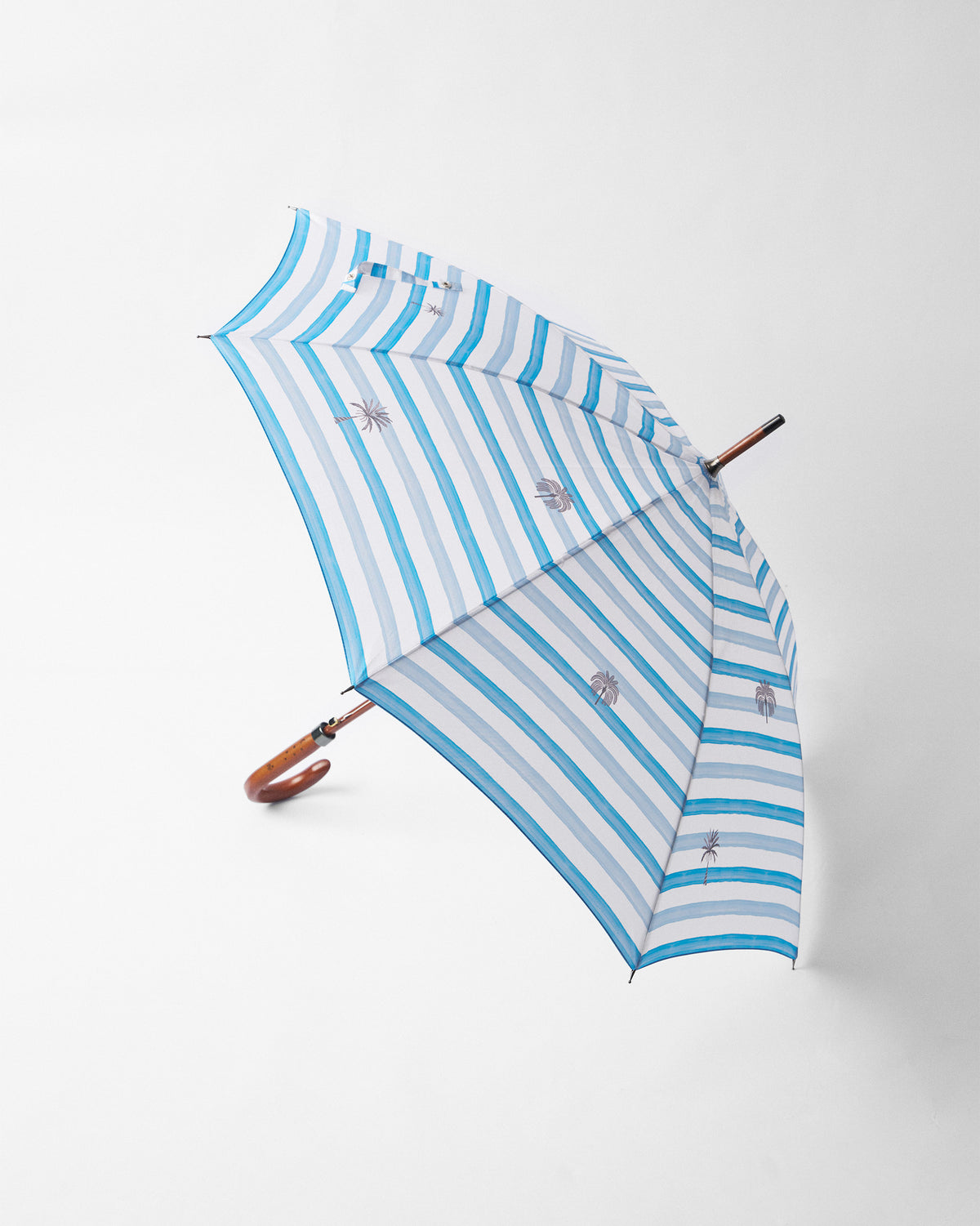 Open River Umbrella with blue and white stripes and small grey motifs.