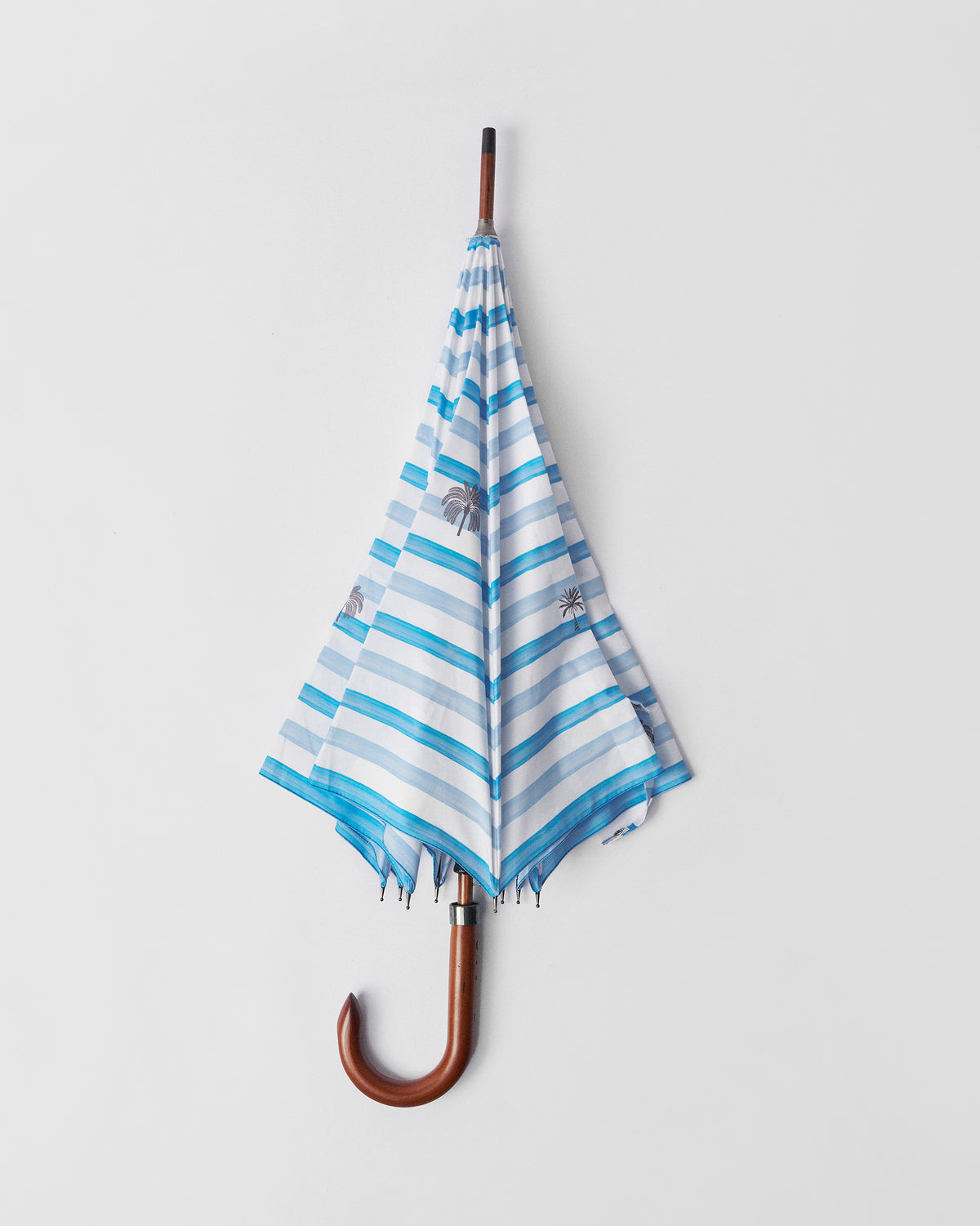 Open River Umbrella seen straight on, with blue and white stripes and a wooden crook handle.