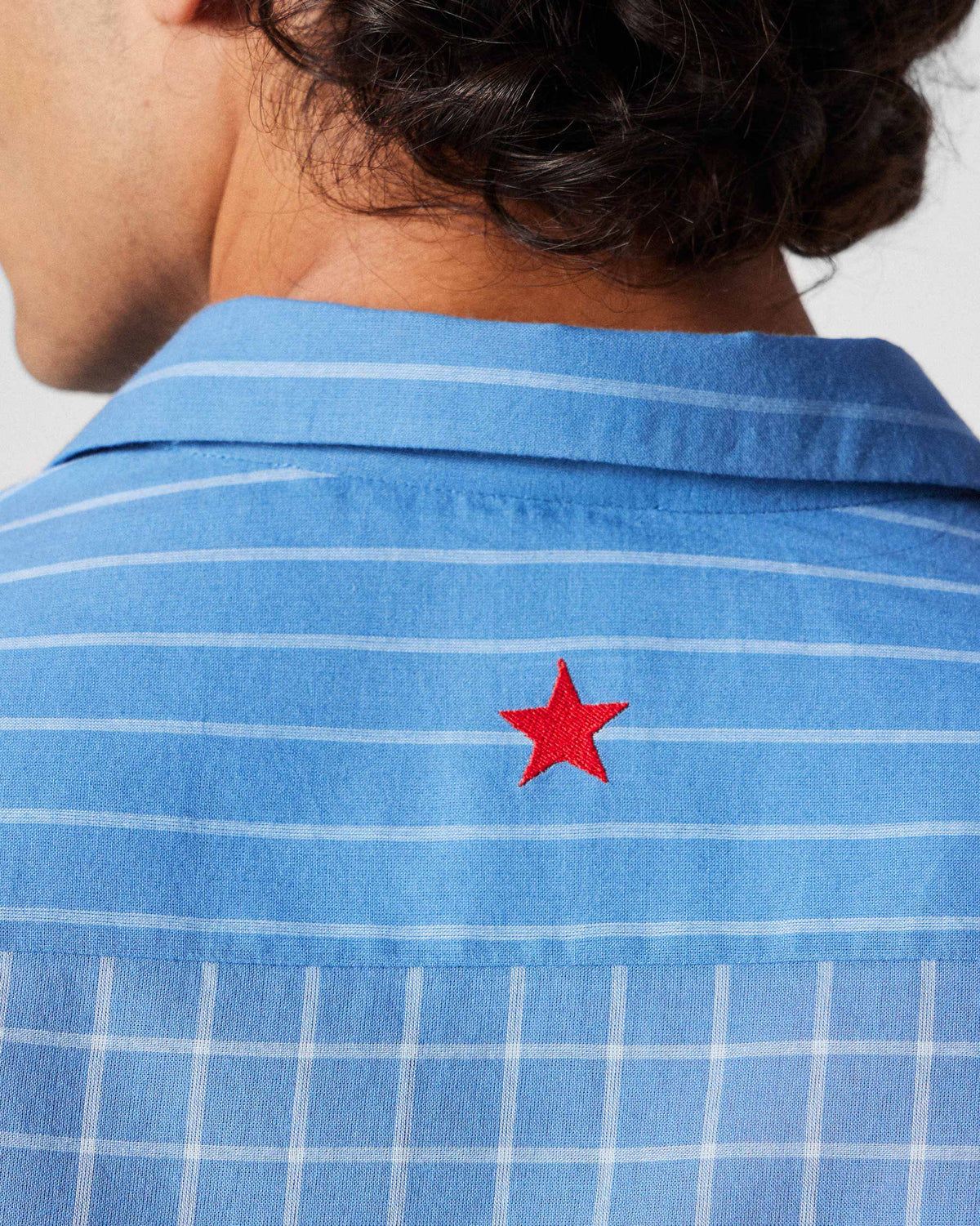 Close-up of a red star on a riverside blue Bias Placket shirt yoke.