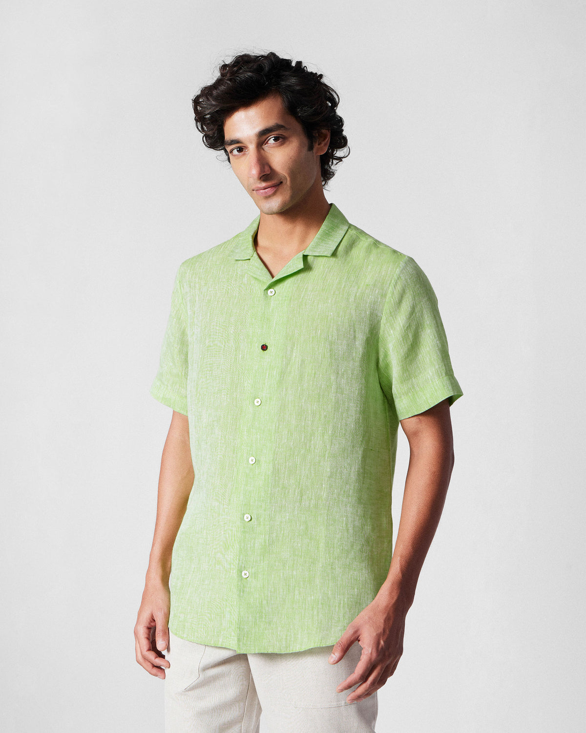 Person wearing a light green Mistari shirt.
