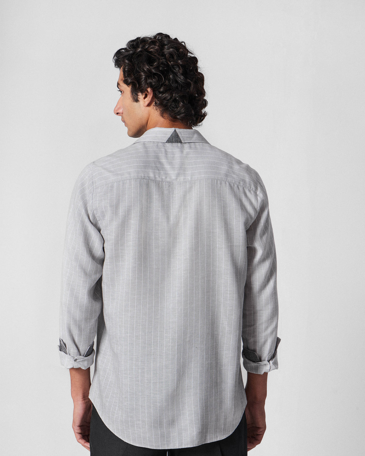 Back of a charcoal striped Silas Shirt with a dark yoke patch.