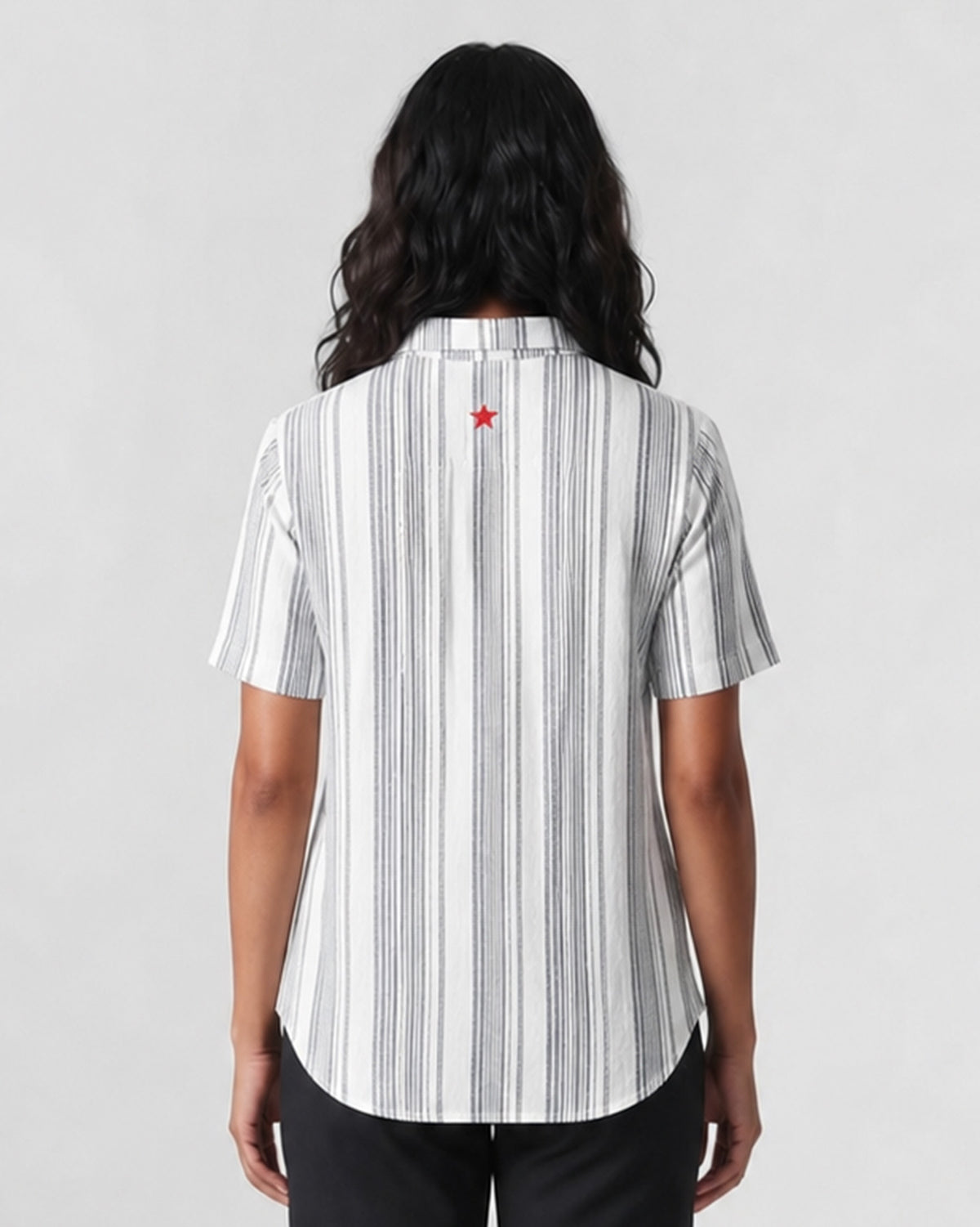 Back of a charcoal and ivory striped Mistari shirt with a red embroidered star.
