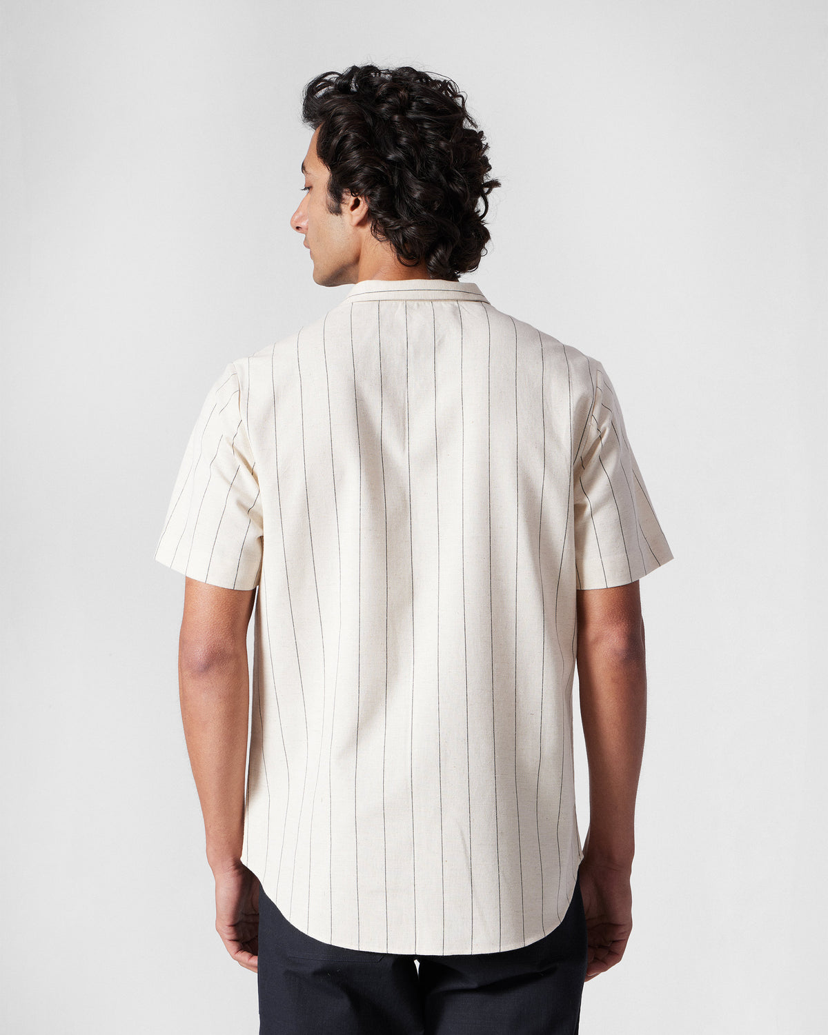 Back of an ivory Riverine Shirt with charcoal pinstripes.