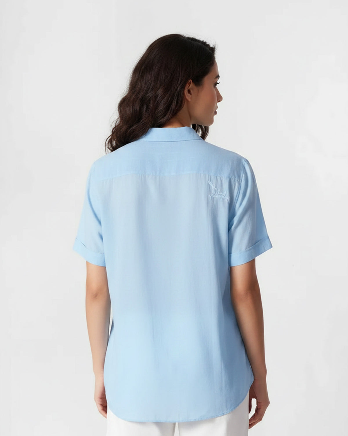 Back of a light blue Half Sleeve Shirt with a small embroidered motif on the yoke.