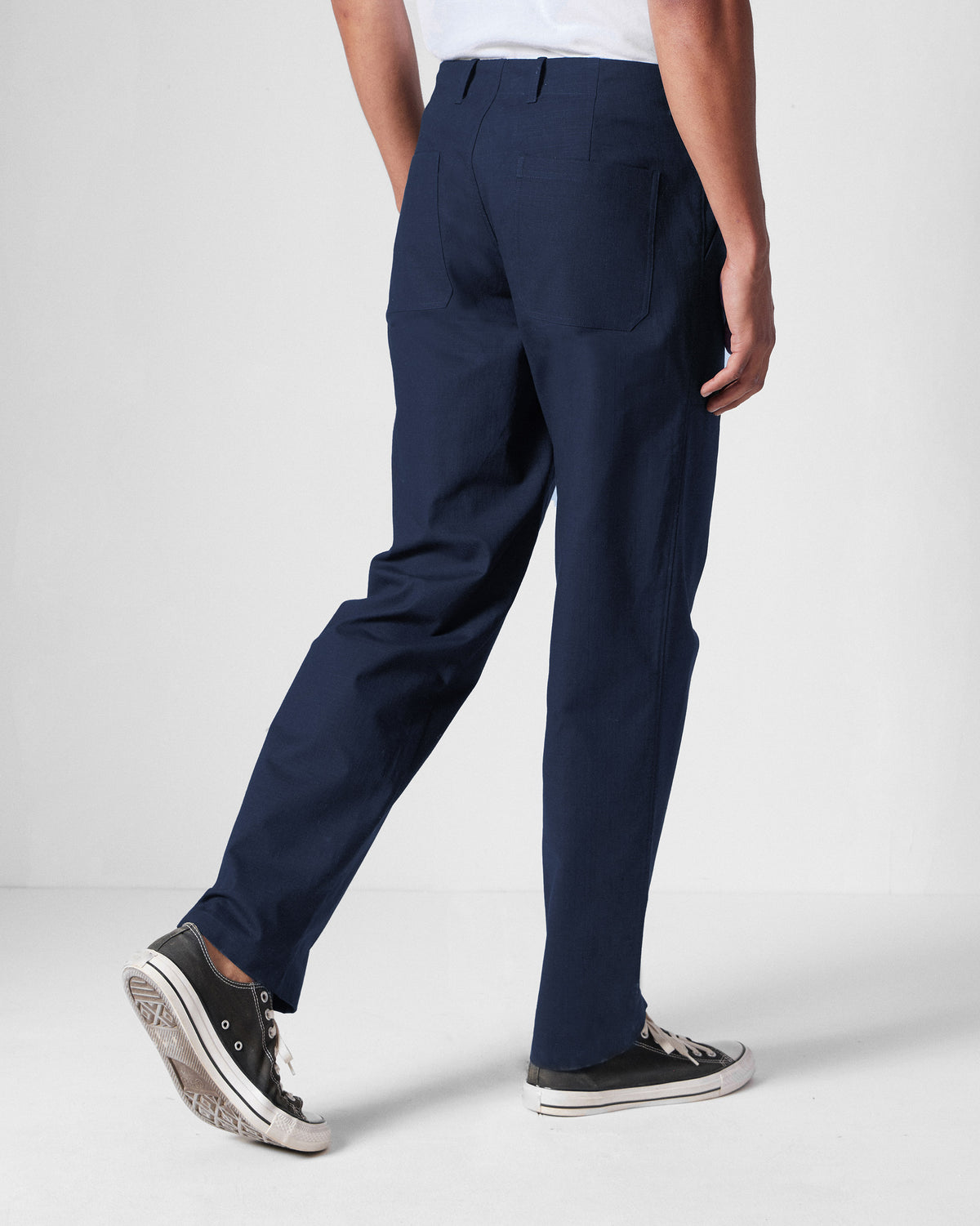 Back of navy Zar Pants worn by a person.